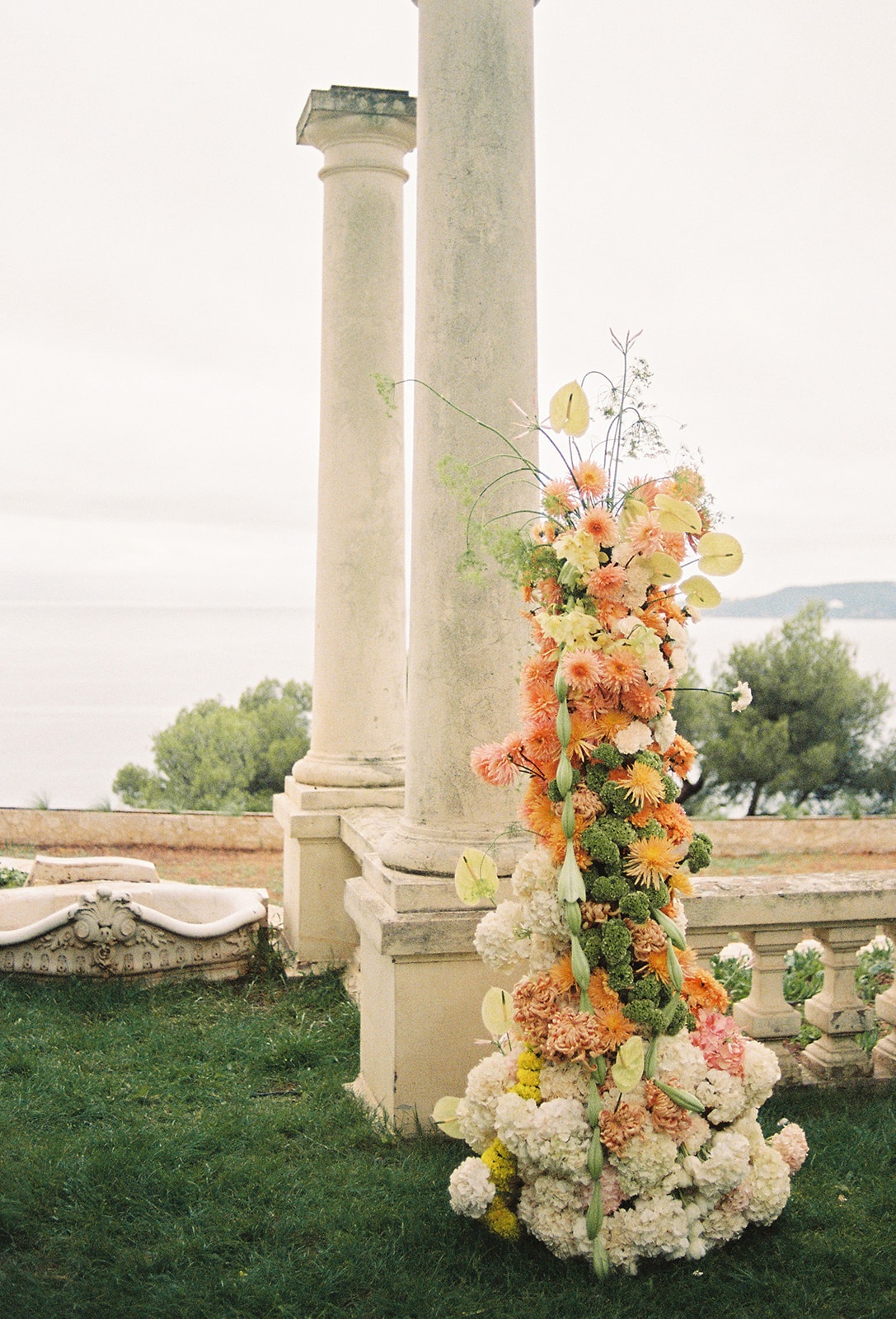 Floral column installation on Mediterranean terrace at Domaine Rocabella