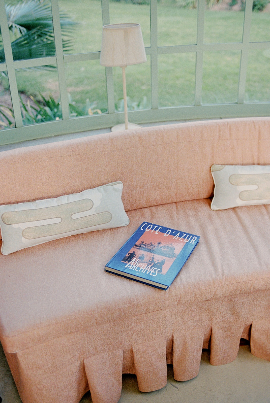 Conservatory sofa with Cote d'Azur book at Domaine Rocabella