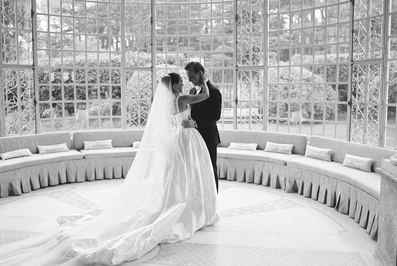 Couple dancing in glass conservatory at Domaine Rocabella