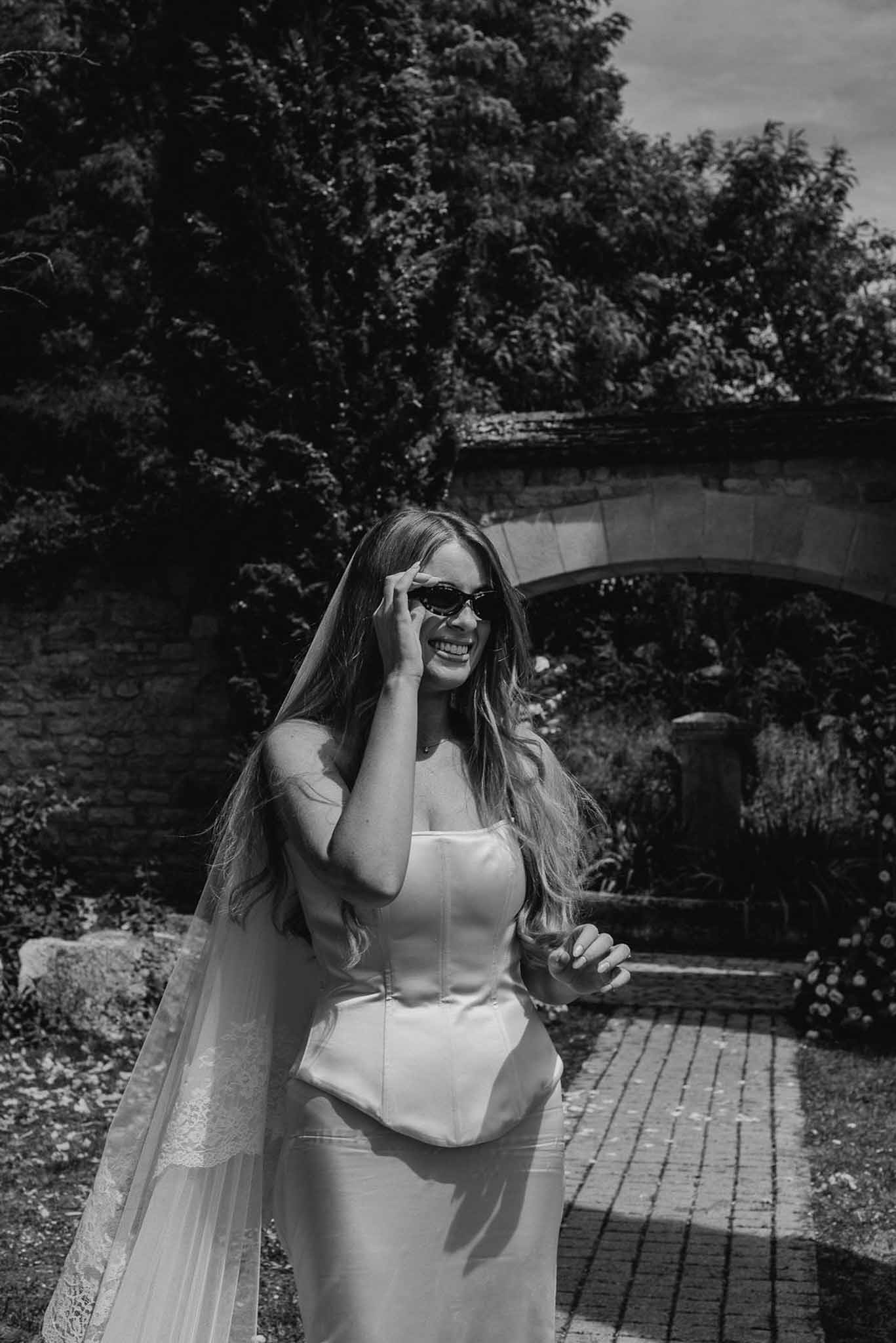 Black and white photo of bridal portrait in a garden