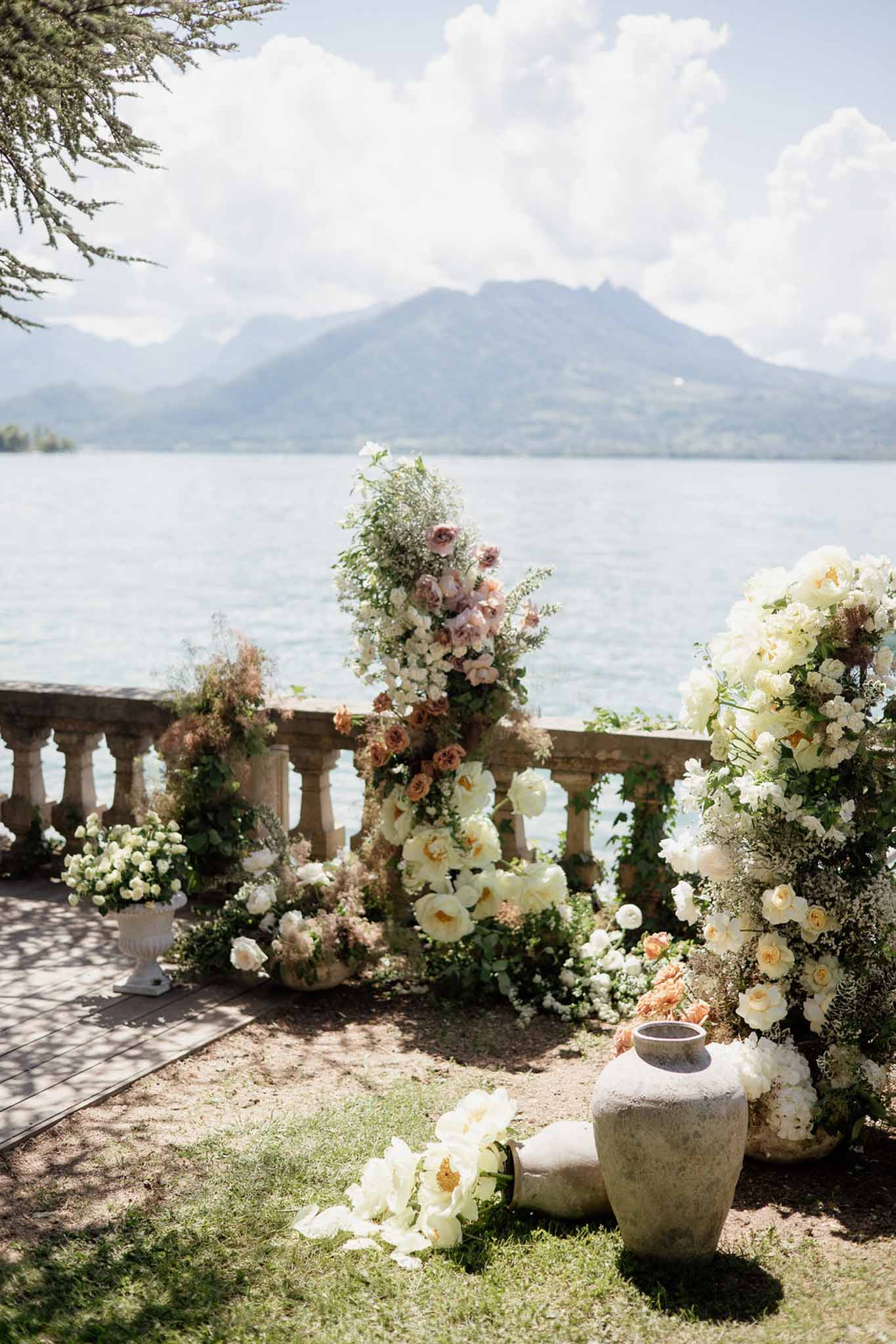 Wedding ceremony setup in a garden with white roses