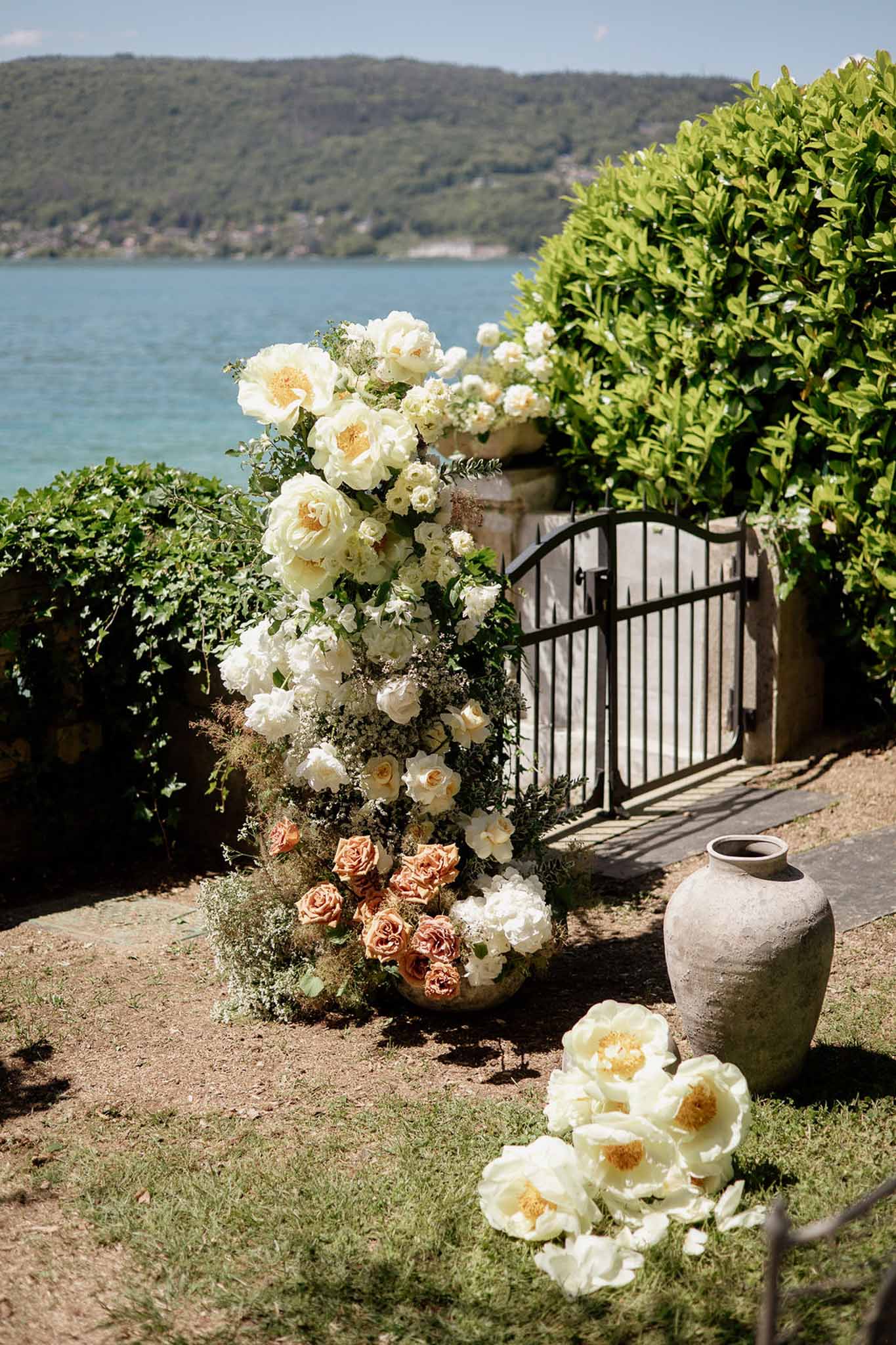 Wedding rings in a garden with white roses