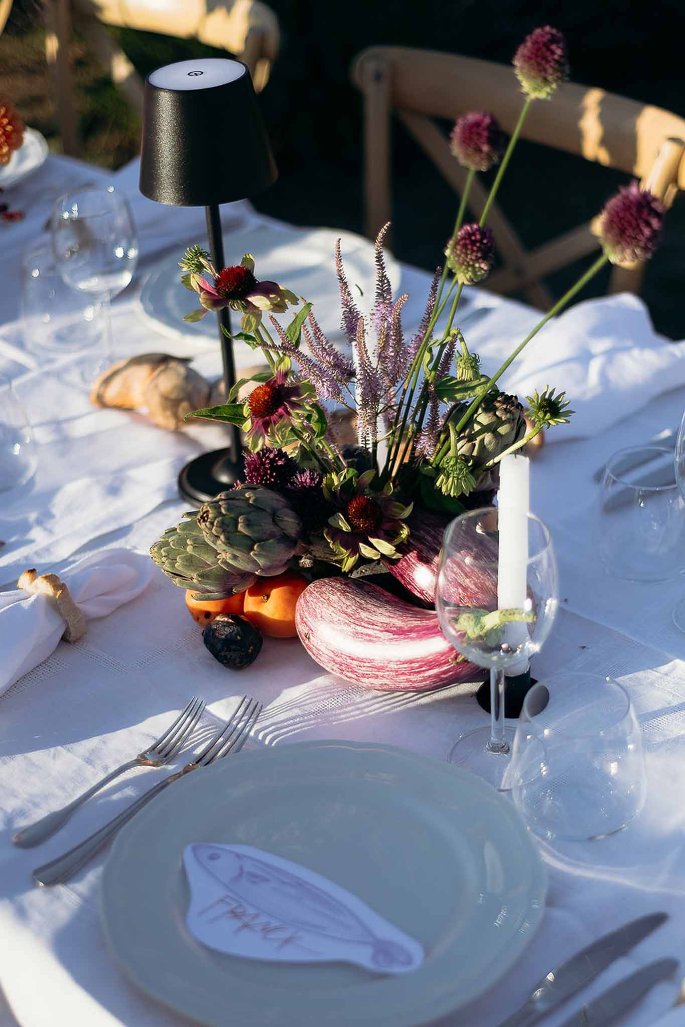 Centerpiece with seasonal vegetables, flowers and lamp at Bastide des Barattes Provençal table
