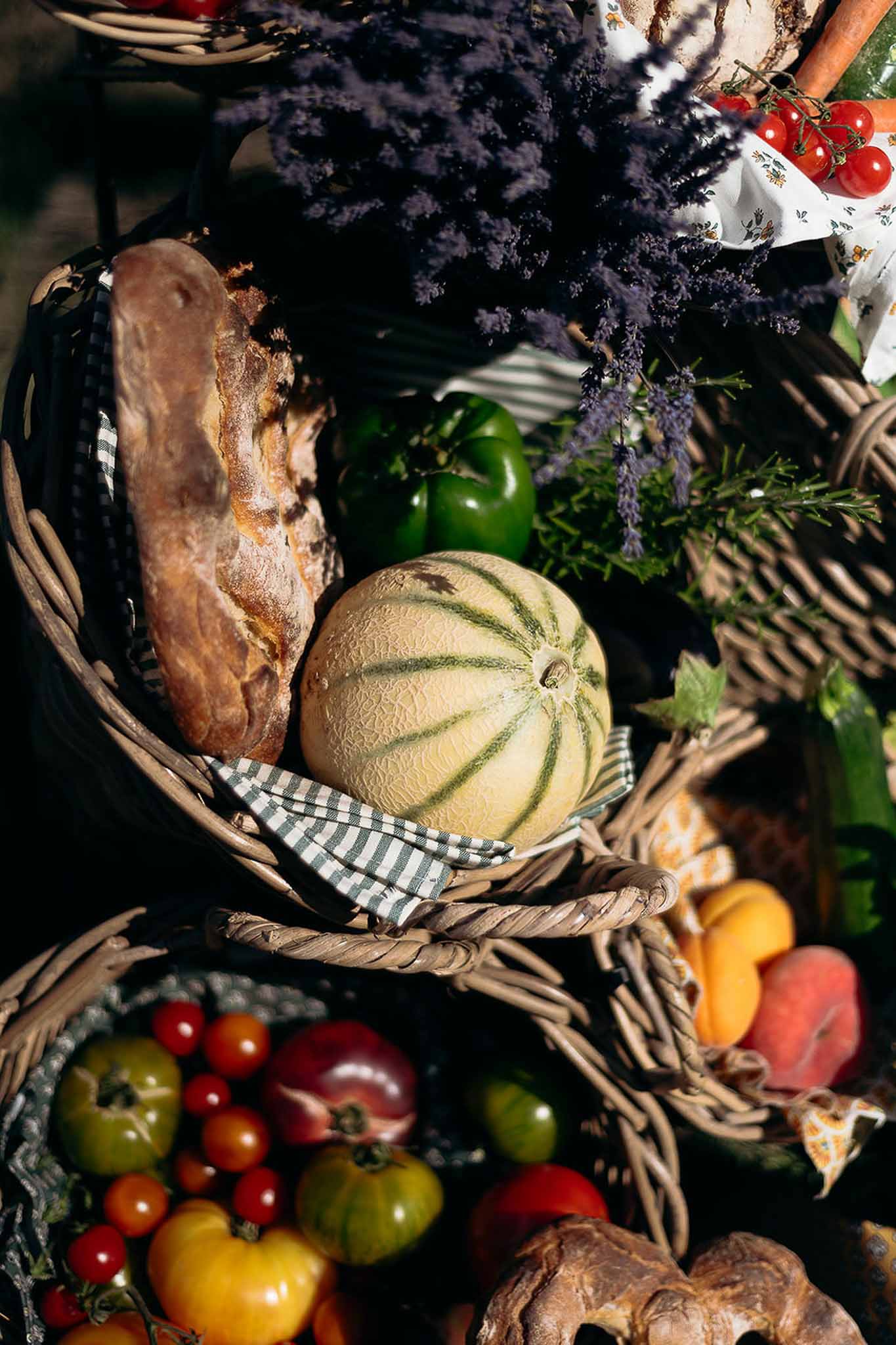 Close-up of seasonal vegetables in wicker baskets as wedding table decor, Bastide des Barattes