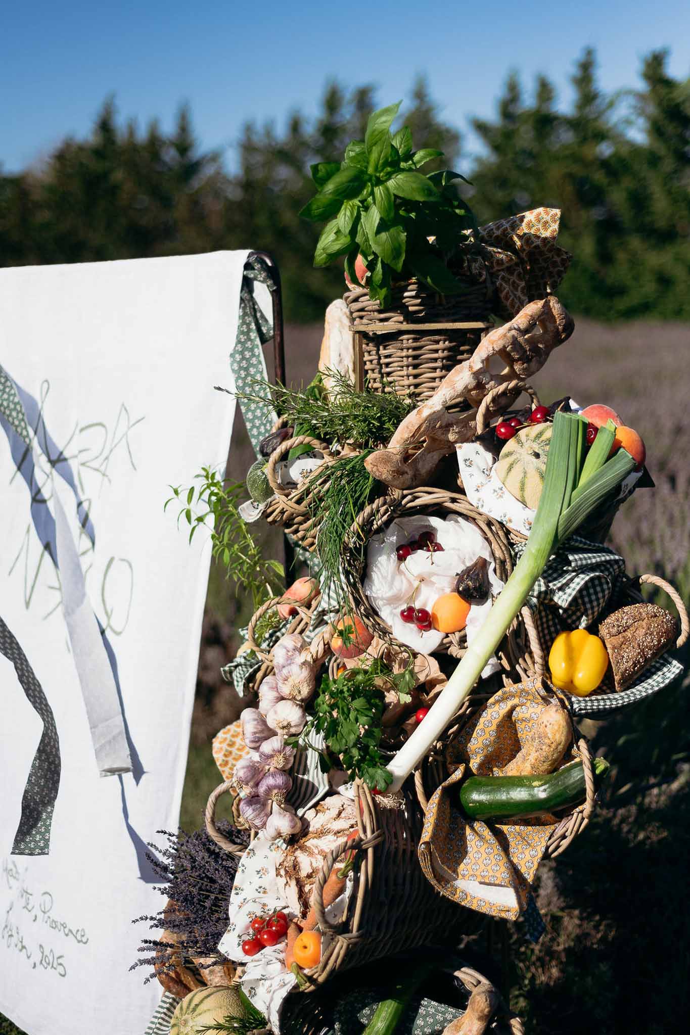Seasonal vegetables in wicker baskets used as reception table decor, Bastide des Barattes Provence