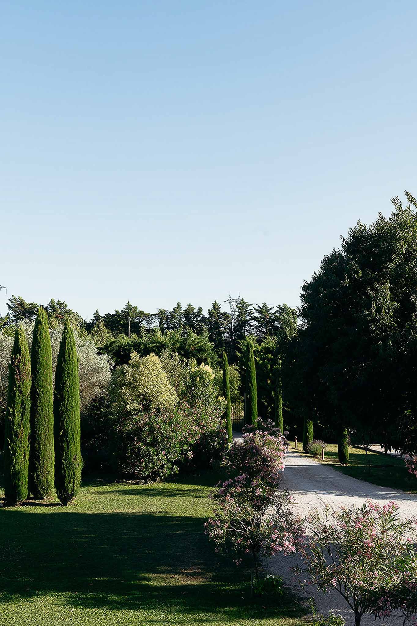 Garden walkway at Bastide des Barattes, historic Provençal bastide exterior in daylight