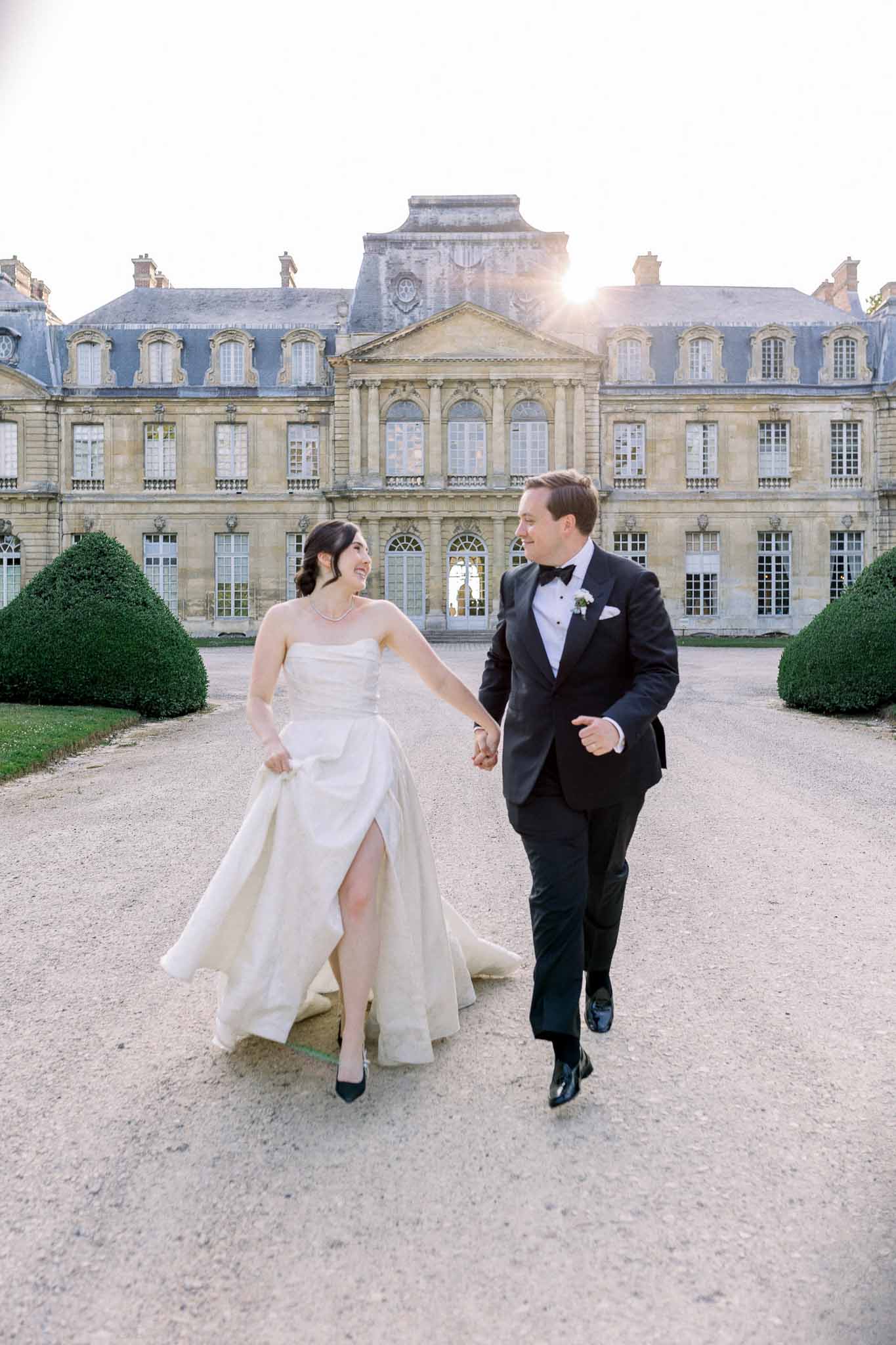 Bride and groom walking hand in hand