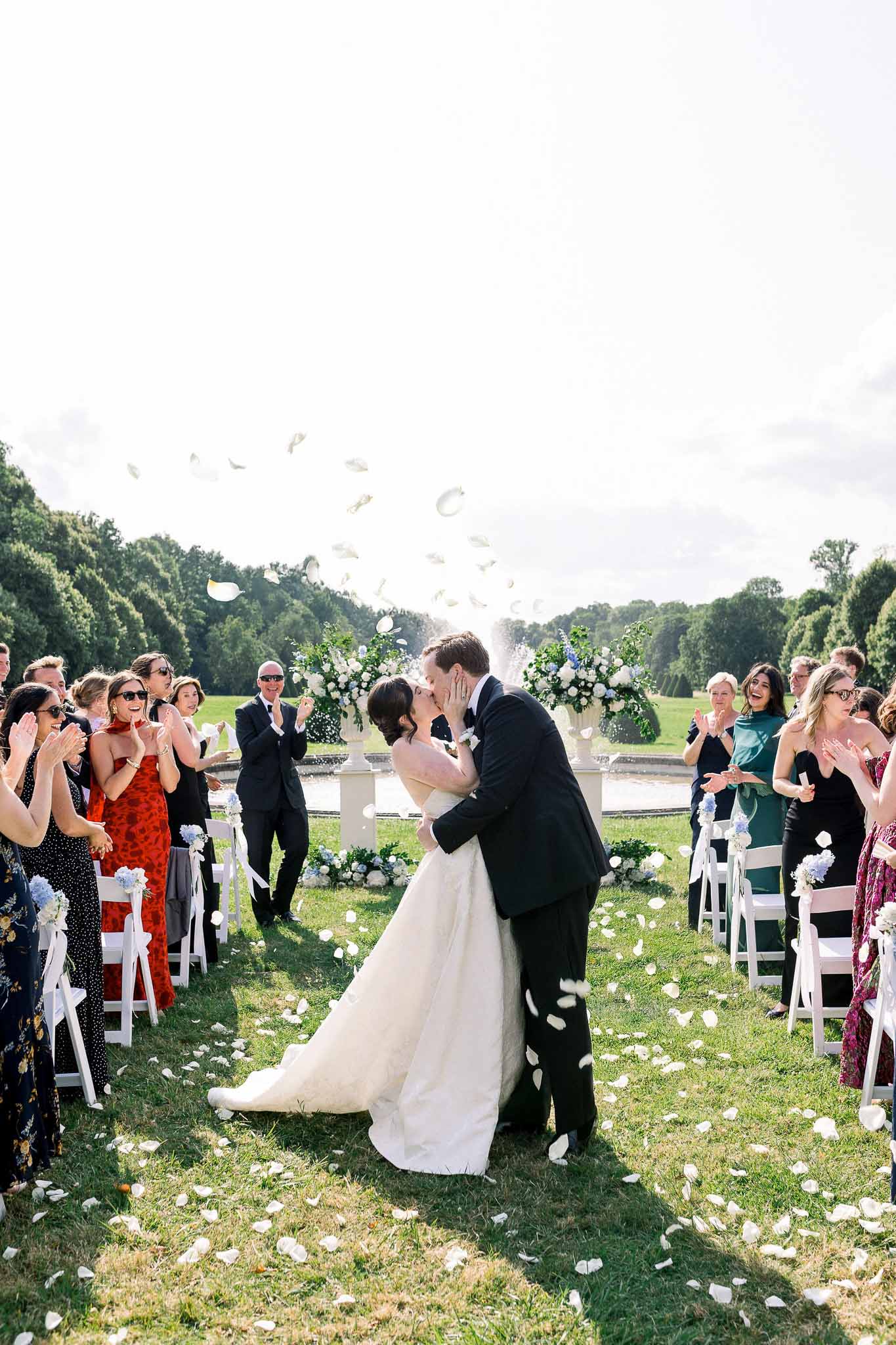 Wedding ceremony setup in a garden with white roses