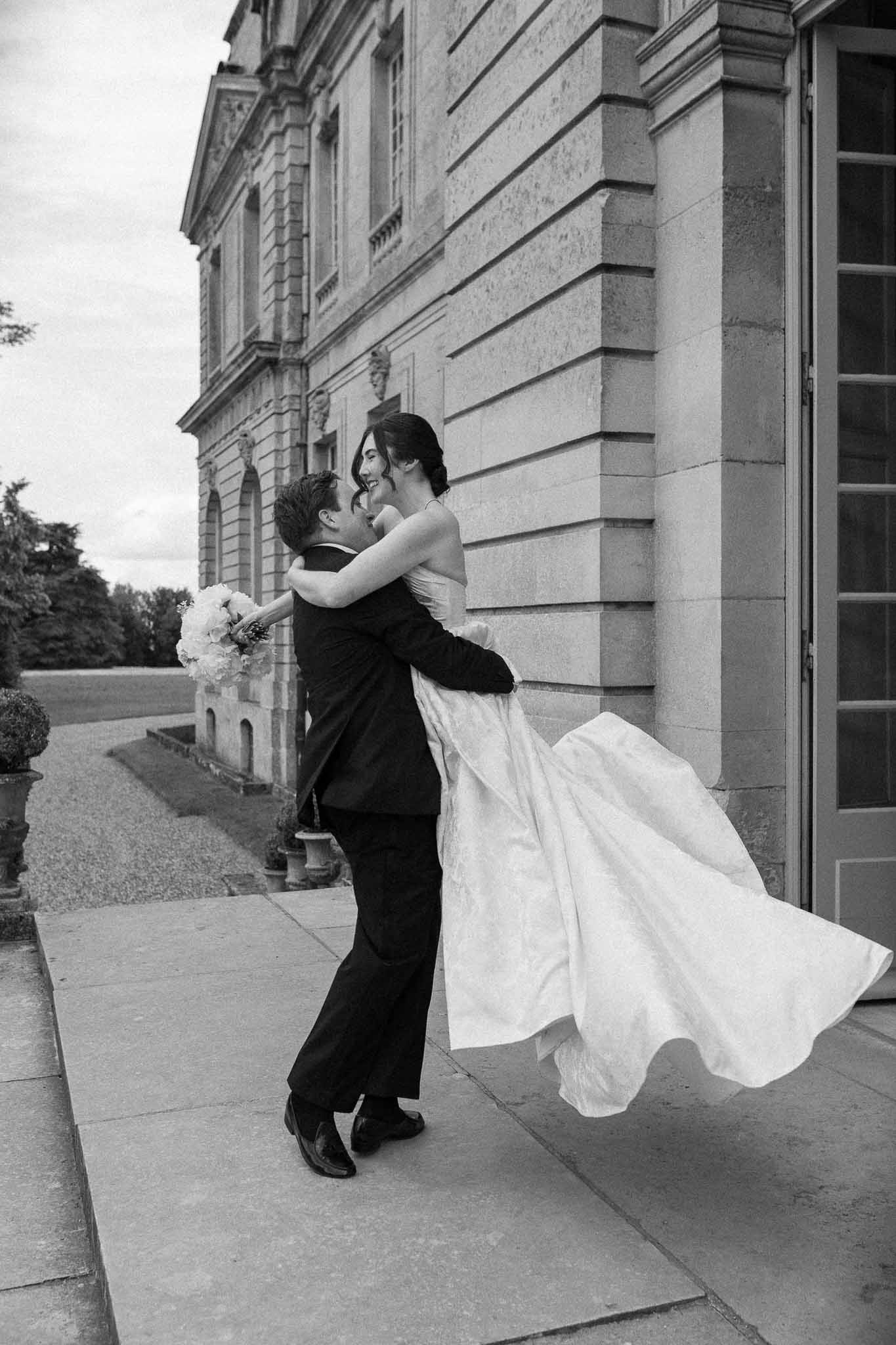 Black and white photo of bride and groom portrait in a garden