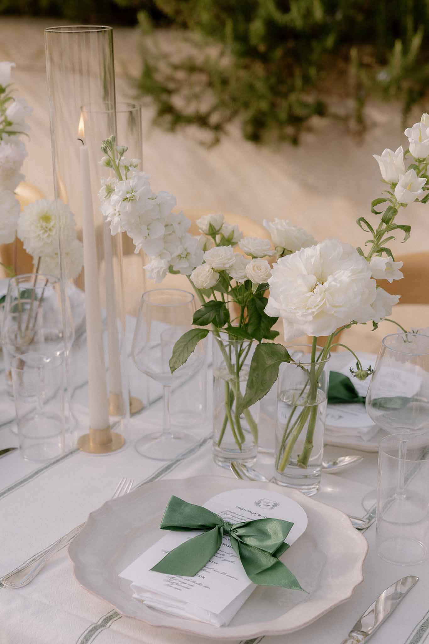 Wedding reception table setting with white roses