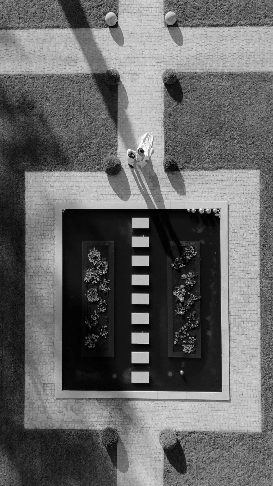 Black and white photo of bride and groom portrait in a garden