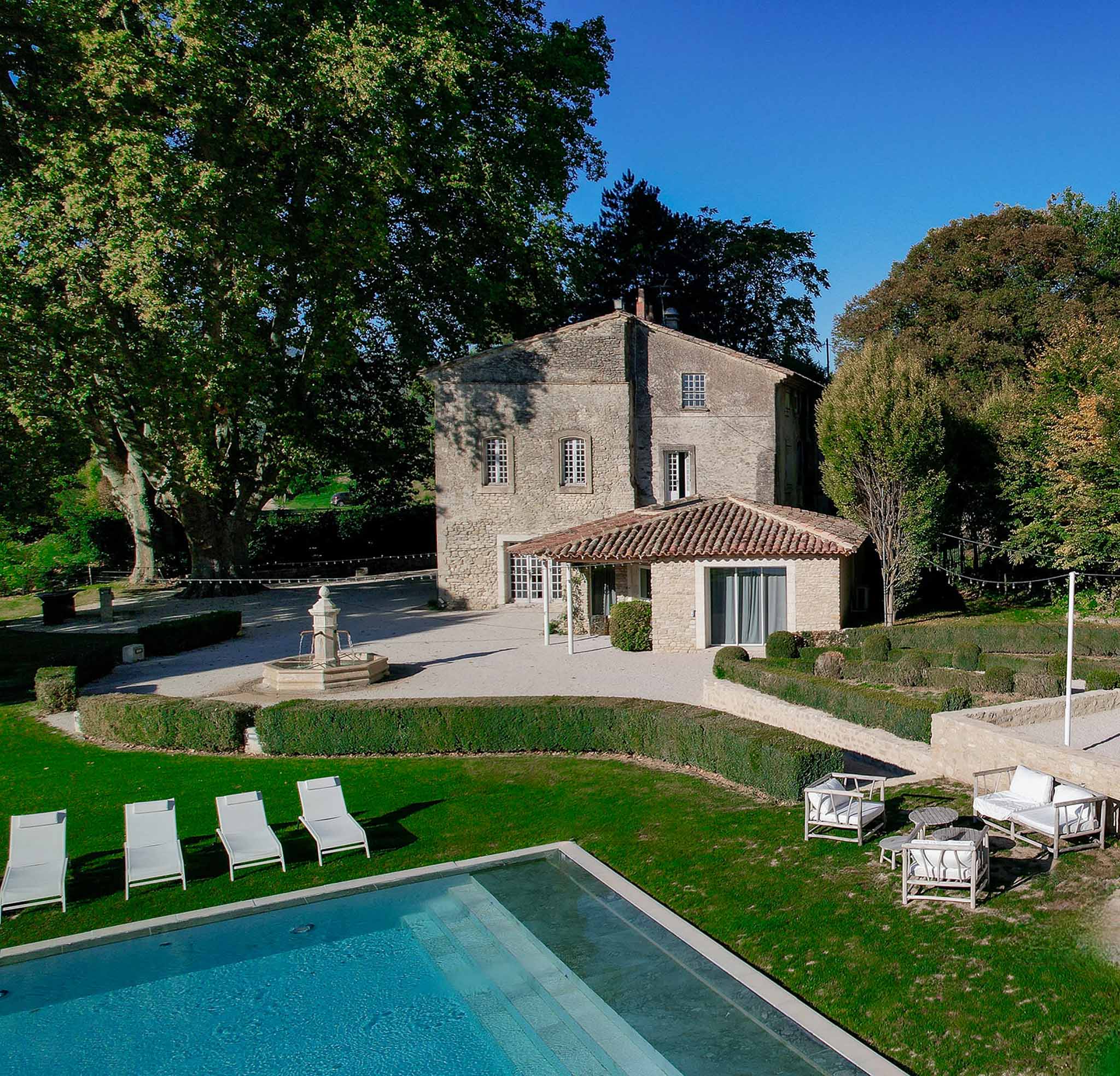 Aerial view of Château du Griffon showing pool and stone architecture
