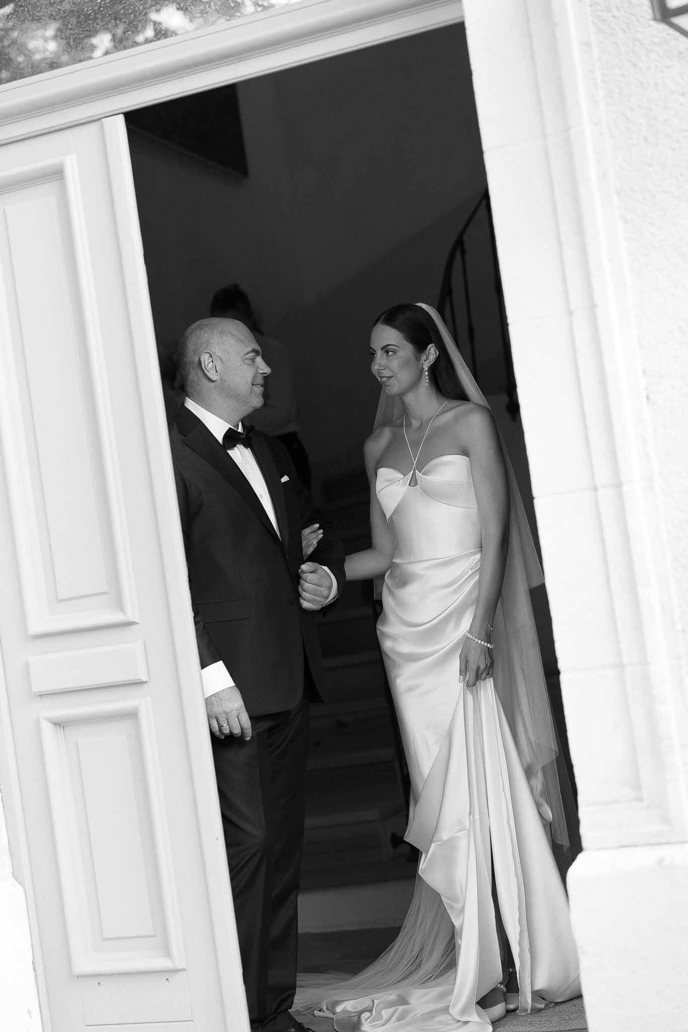 Black and white photo of wedding ceremony in a chapel