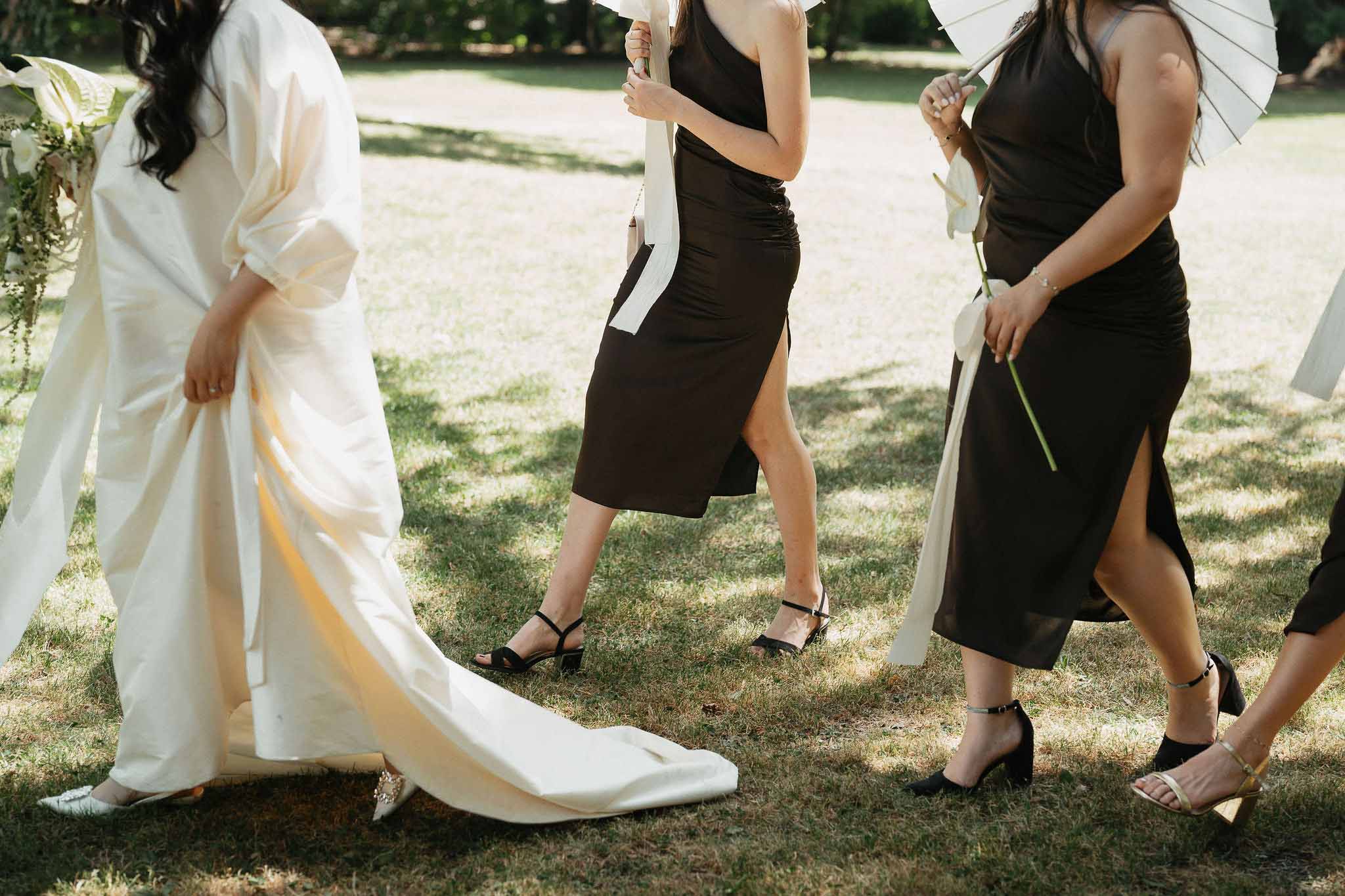 Black and white photo of bridal party in a garden