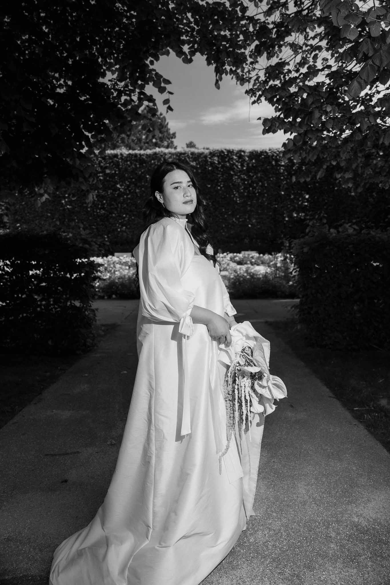 Black and white photo of bridal portrait in a garden