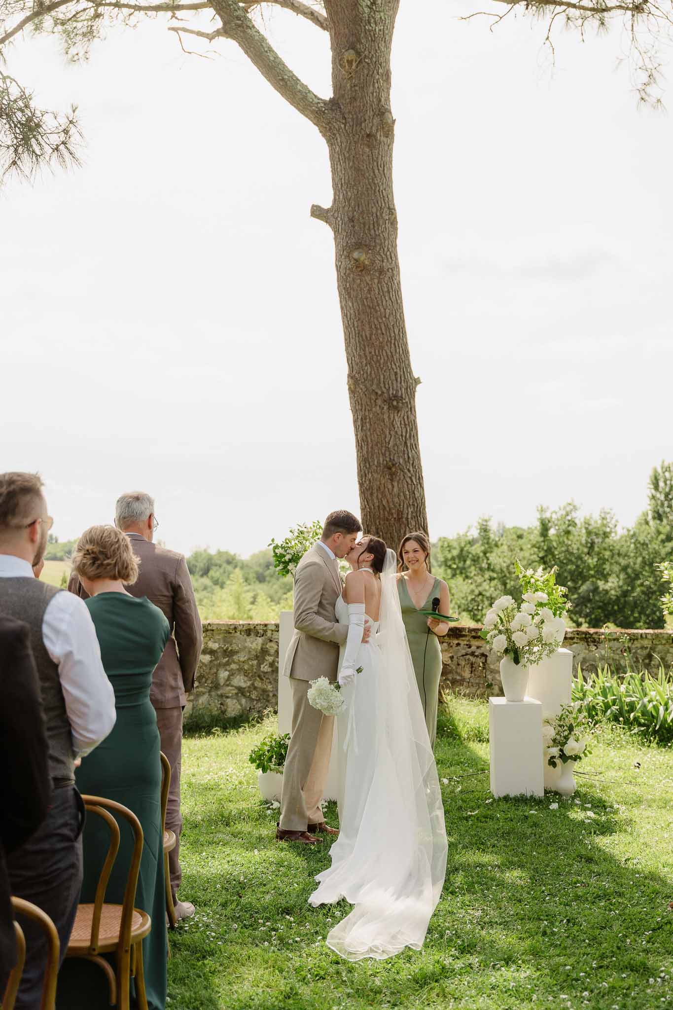 Wedding ceremony setup in a garden with white roses