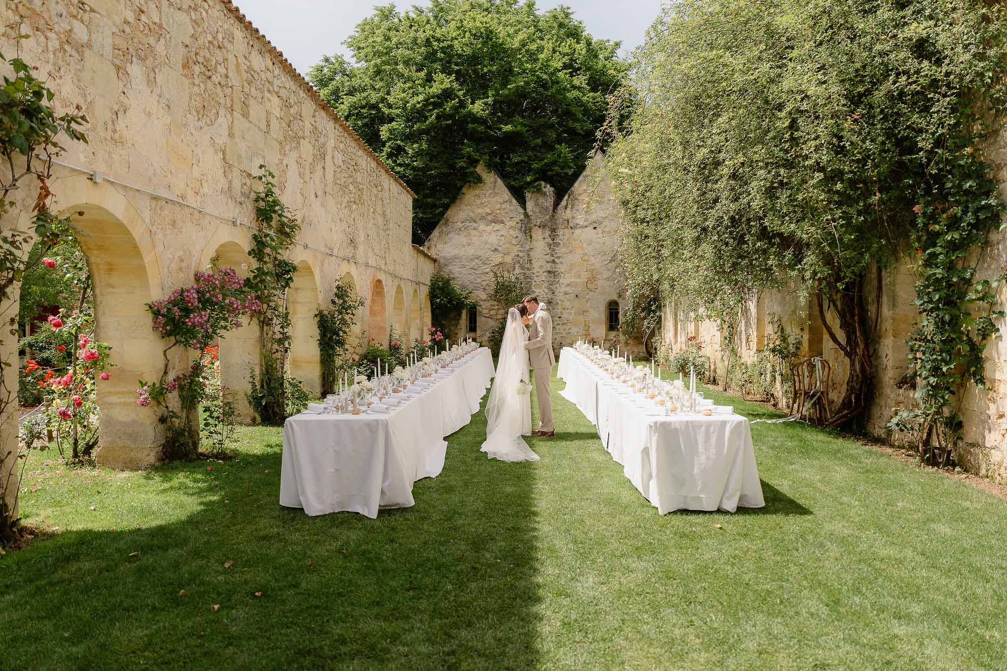 Wedding reception table setting with white roses