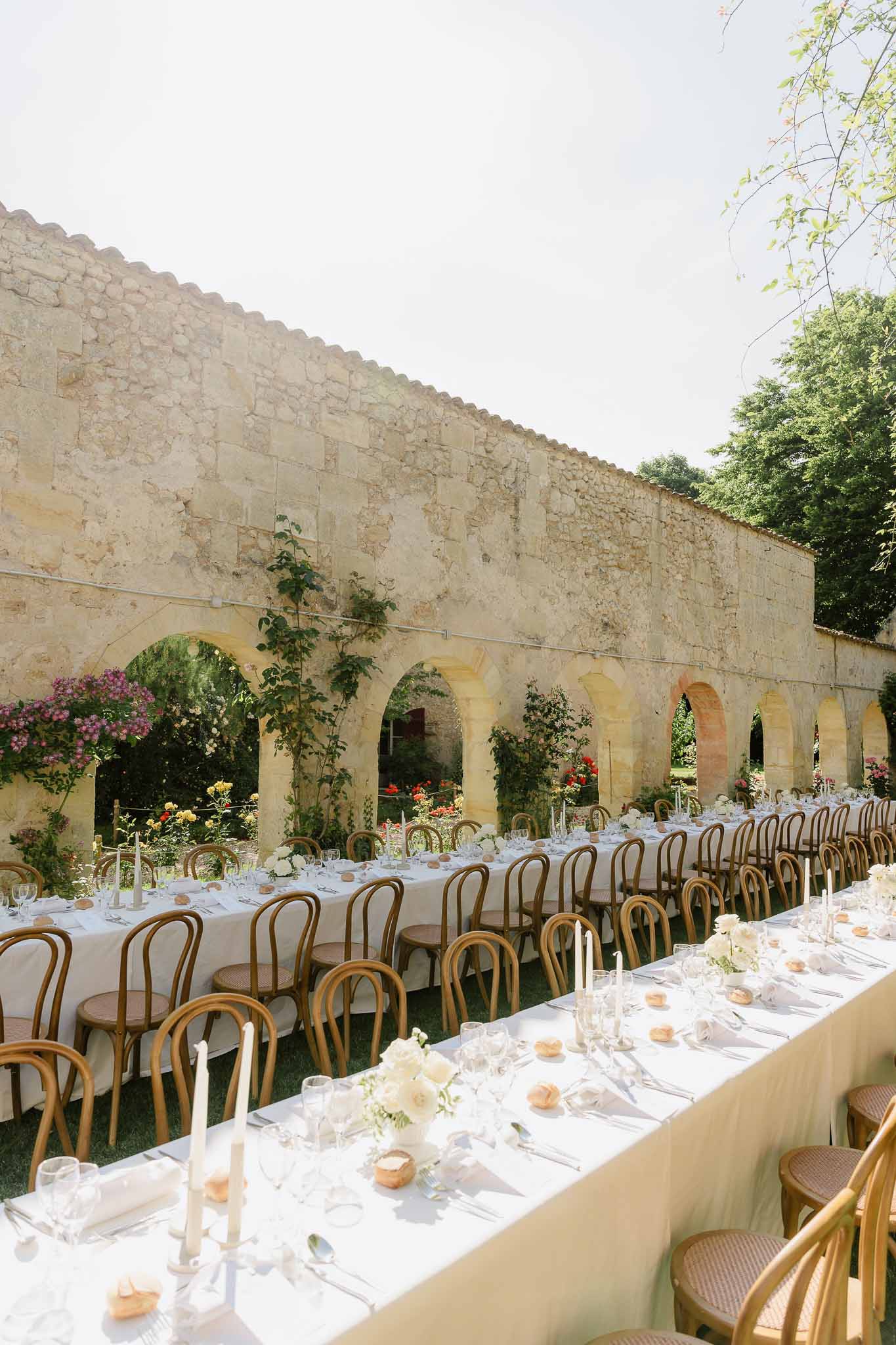 Wedding reception table setting with white roses