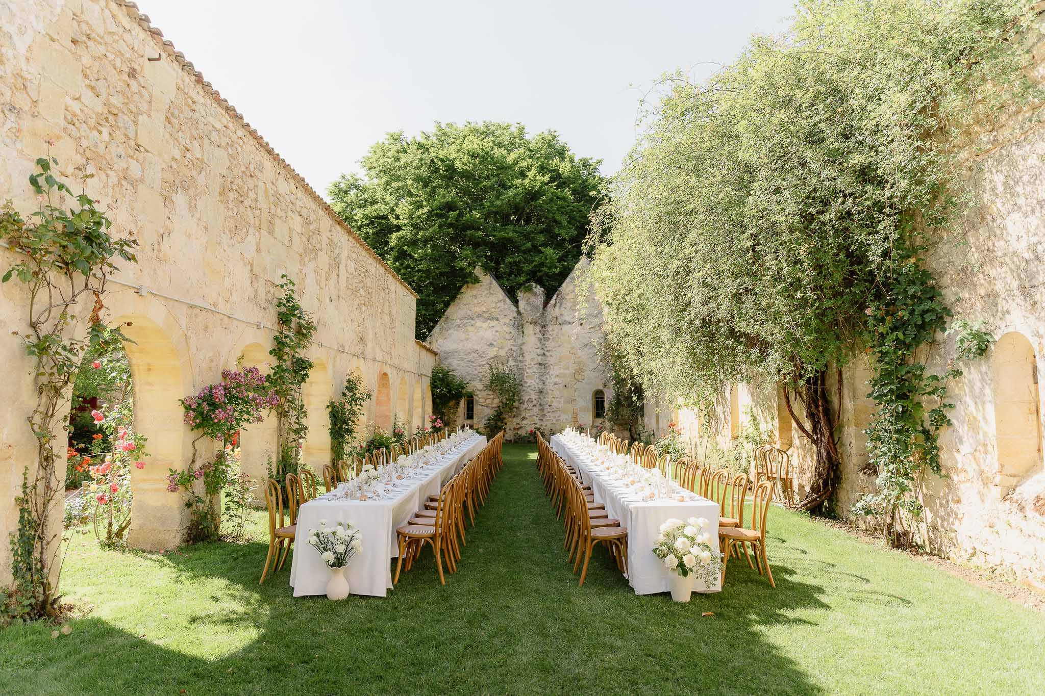 Wedding reception table setting with white roses