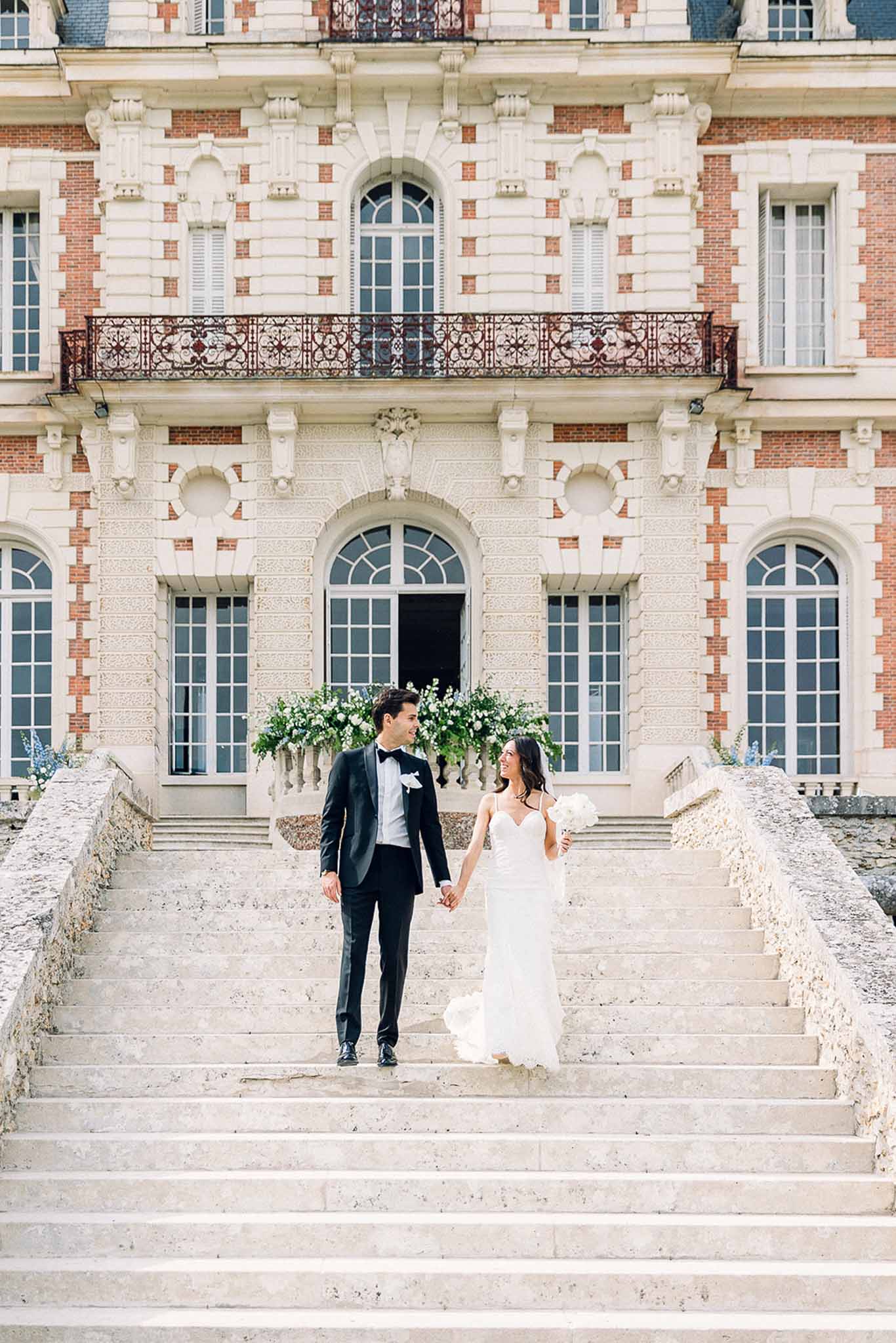 Bride and groom walking hand in hand