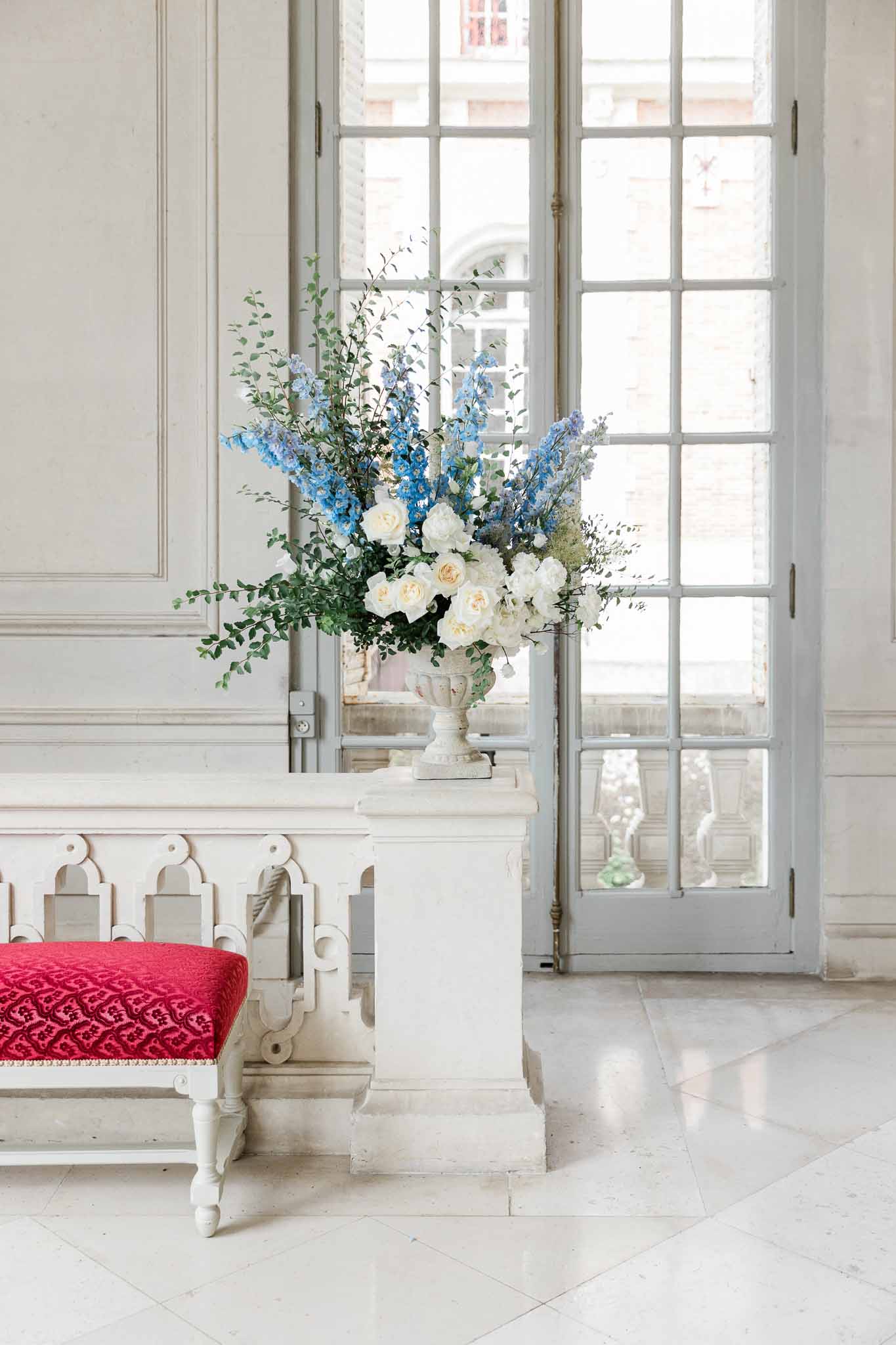 Wedding rings in a garden with white roses