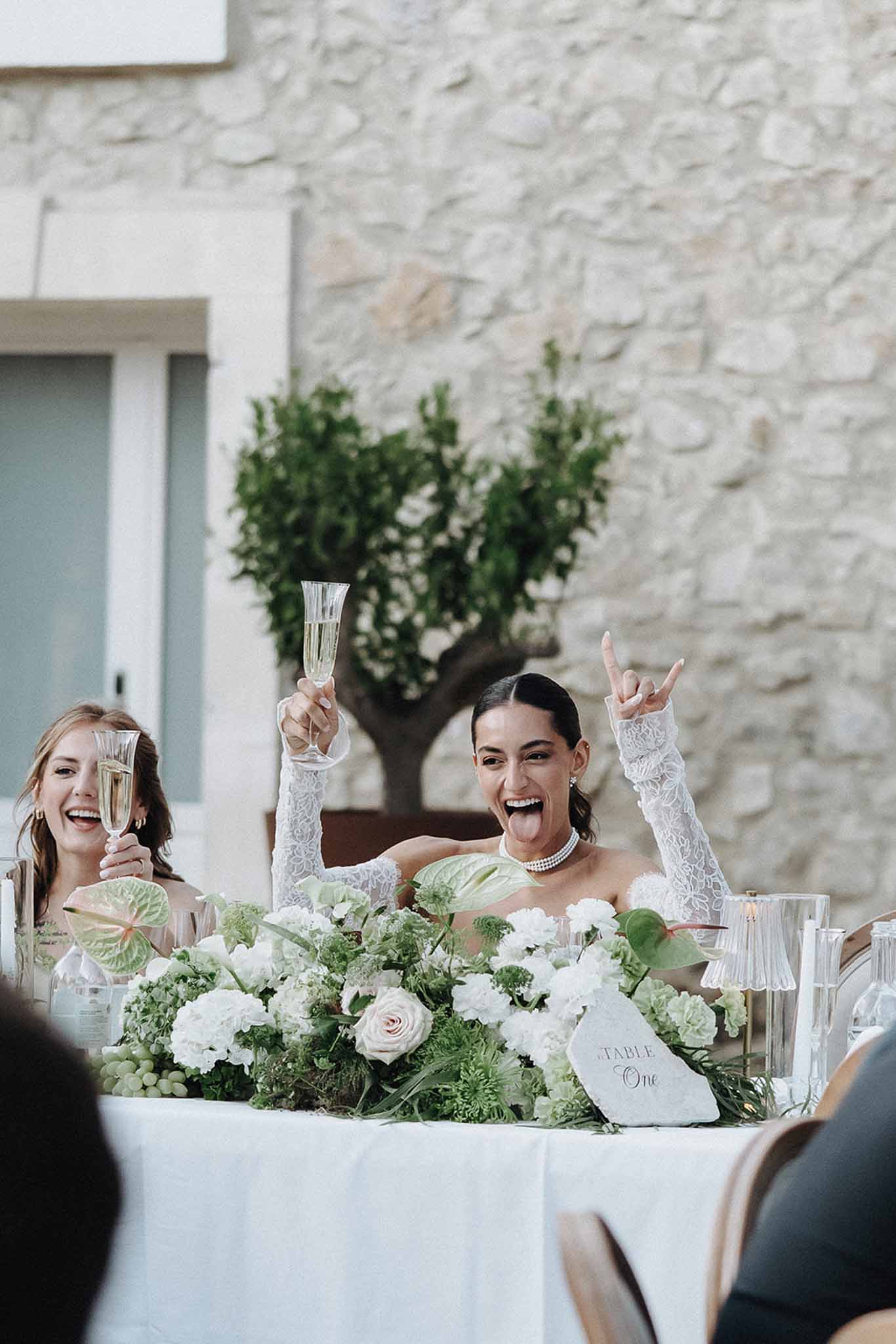Wedding reception table setting with white roses