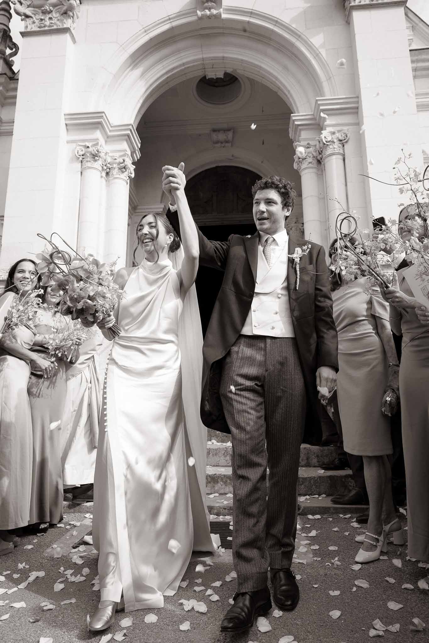 Black and white photo of bride and groom portrait in a chapel