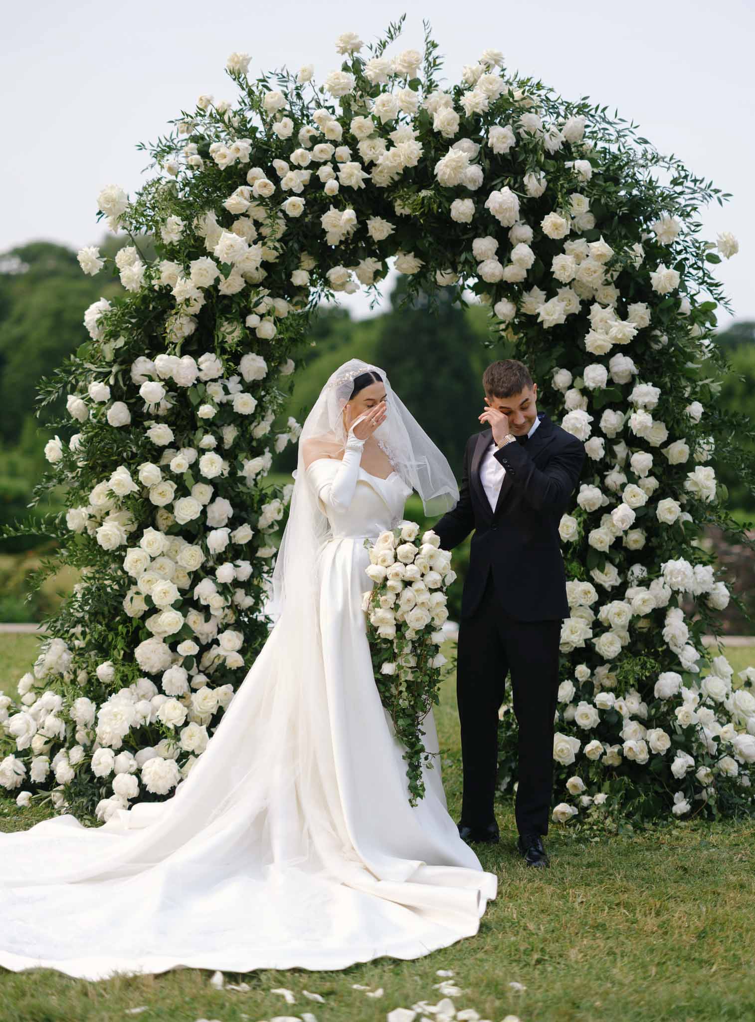 Wedding ceremony in a garden with white roses