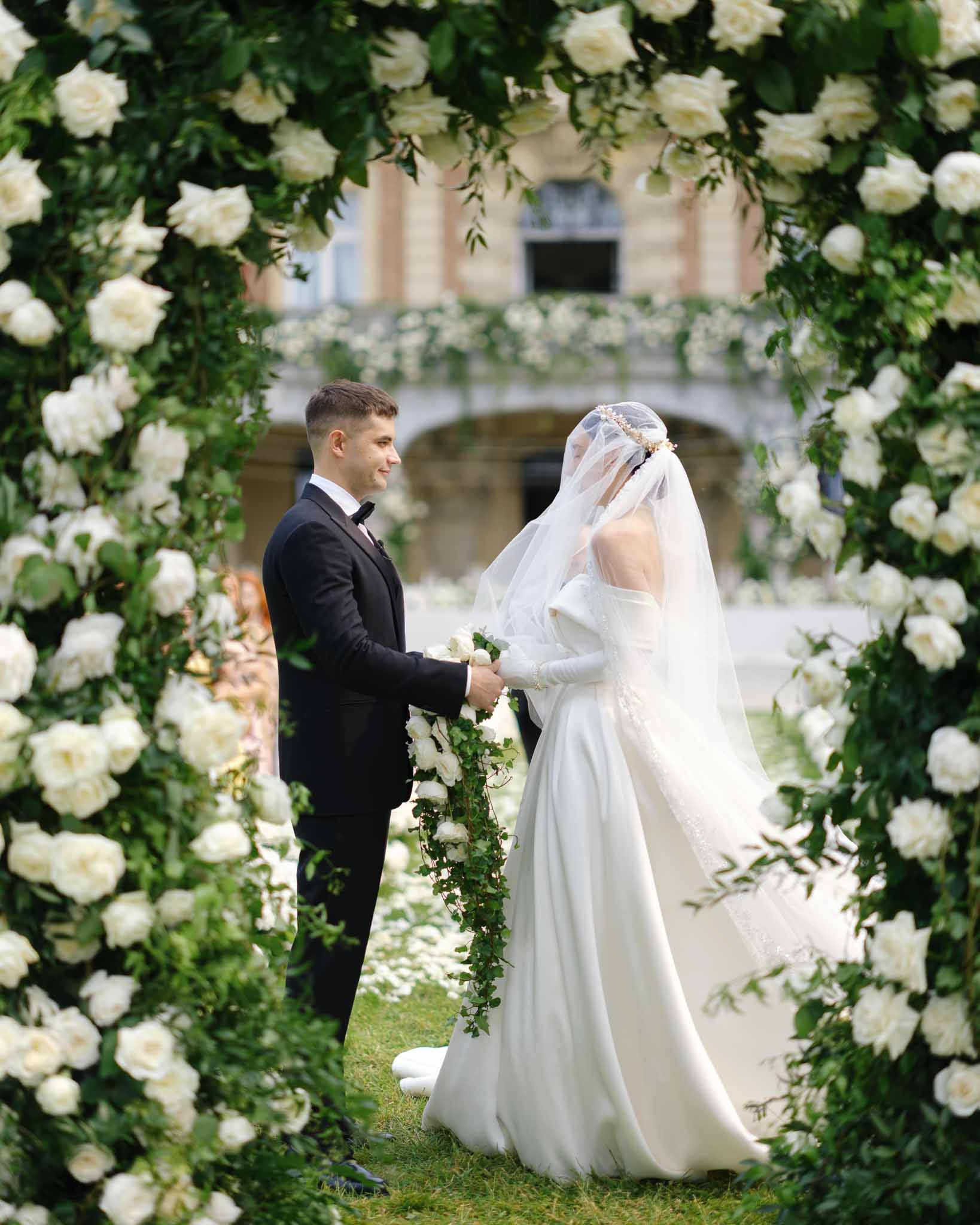 Wedding ceremony in a garden with white roses