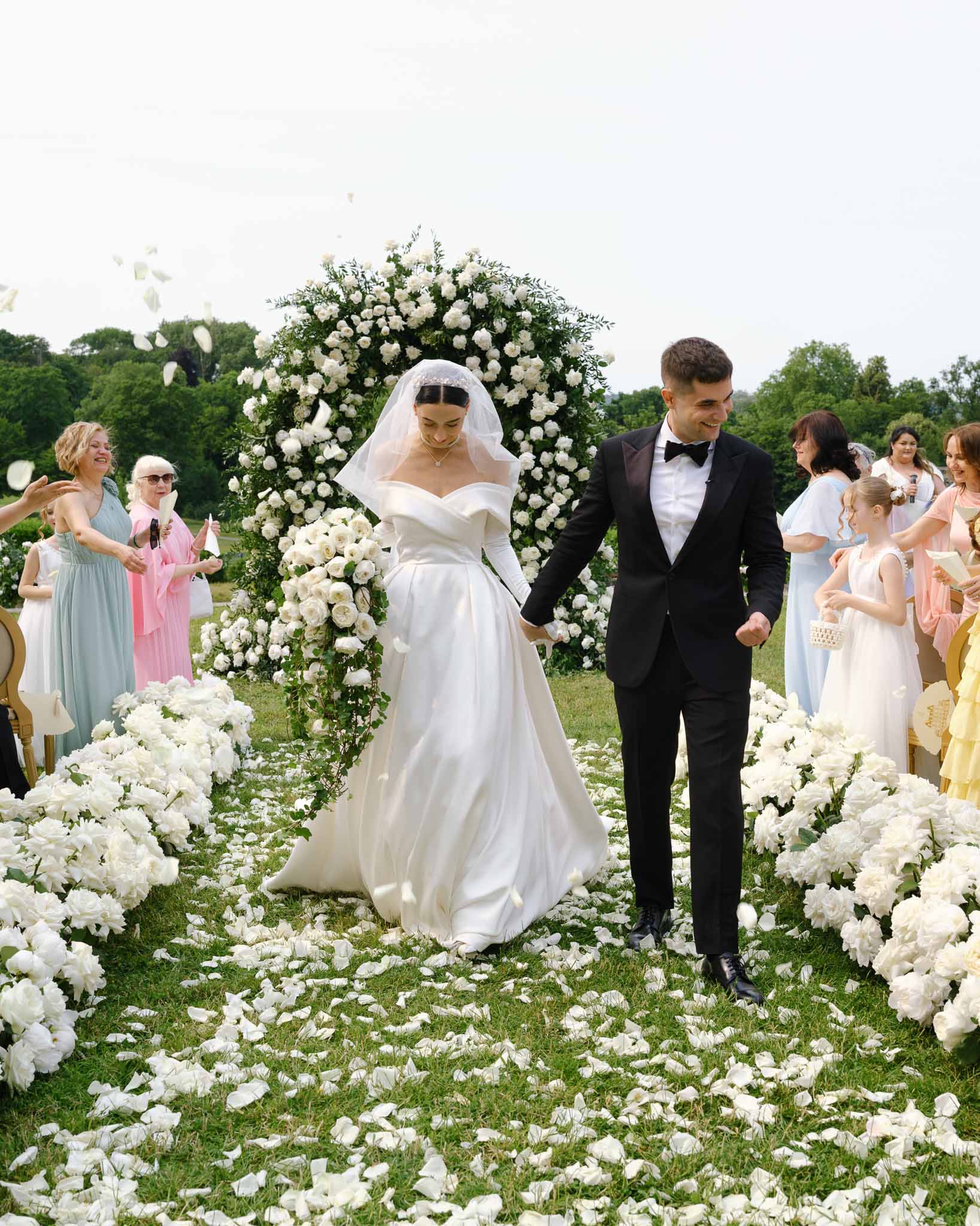 Wedding ceremony in a garden with white roses