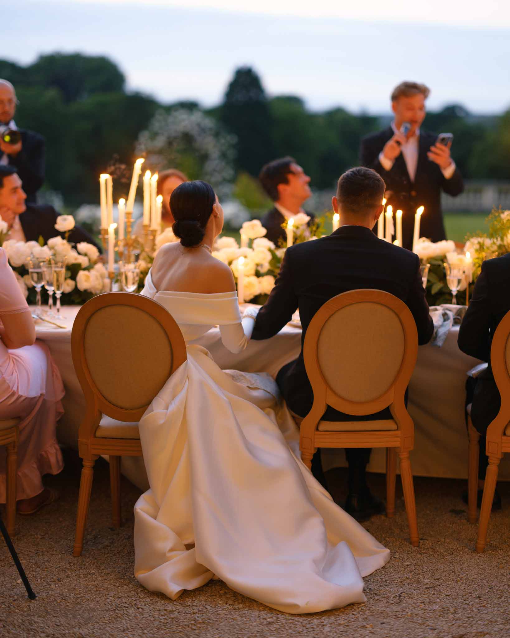 Wedding reception table setting with white roses