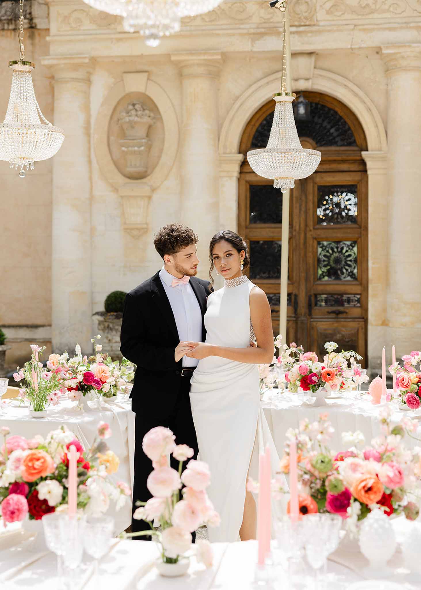 Bride and groom holding hands at reception at Château Martinay, Provence