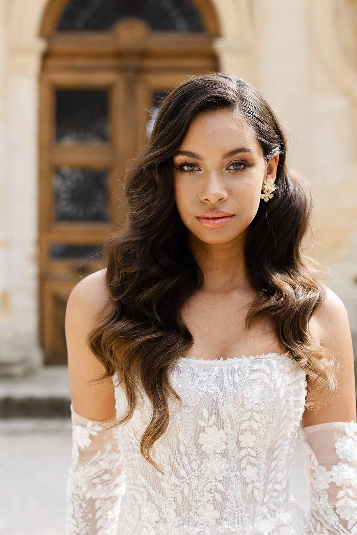 Bride with wavy hair down, side profile, at Château Martinay