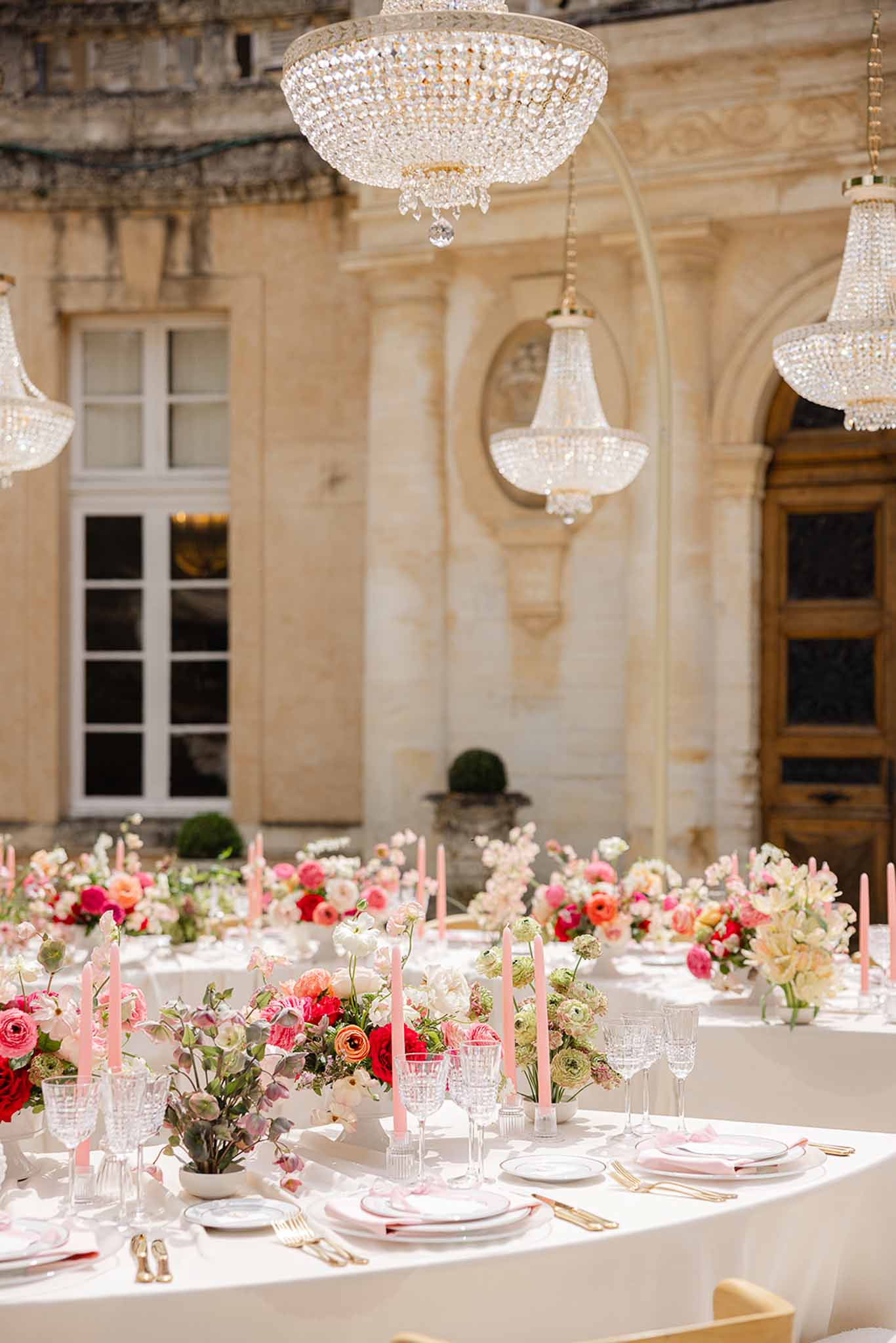 Crystal chandelier above reception table centrepiece at Château Martinay