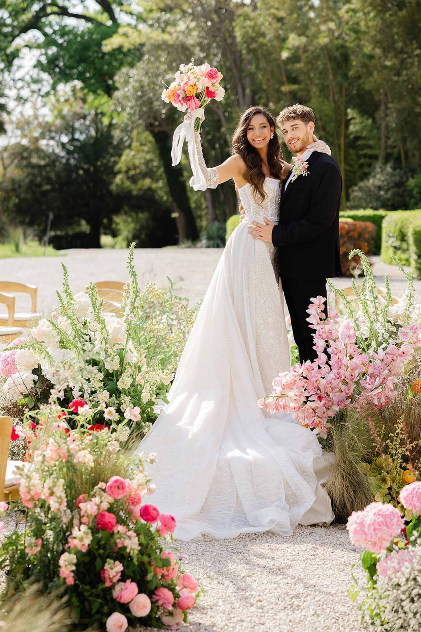 Couple embracing at flower-decorated altar at Château Martinay, Provence
