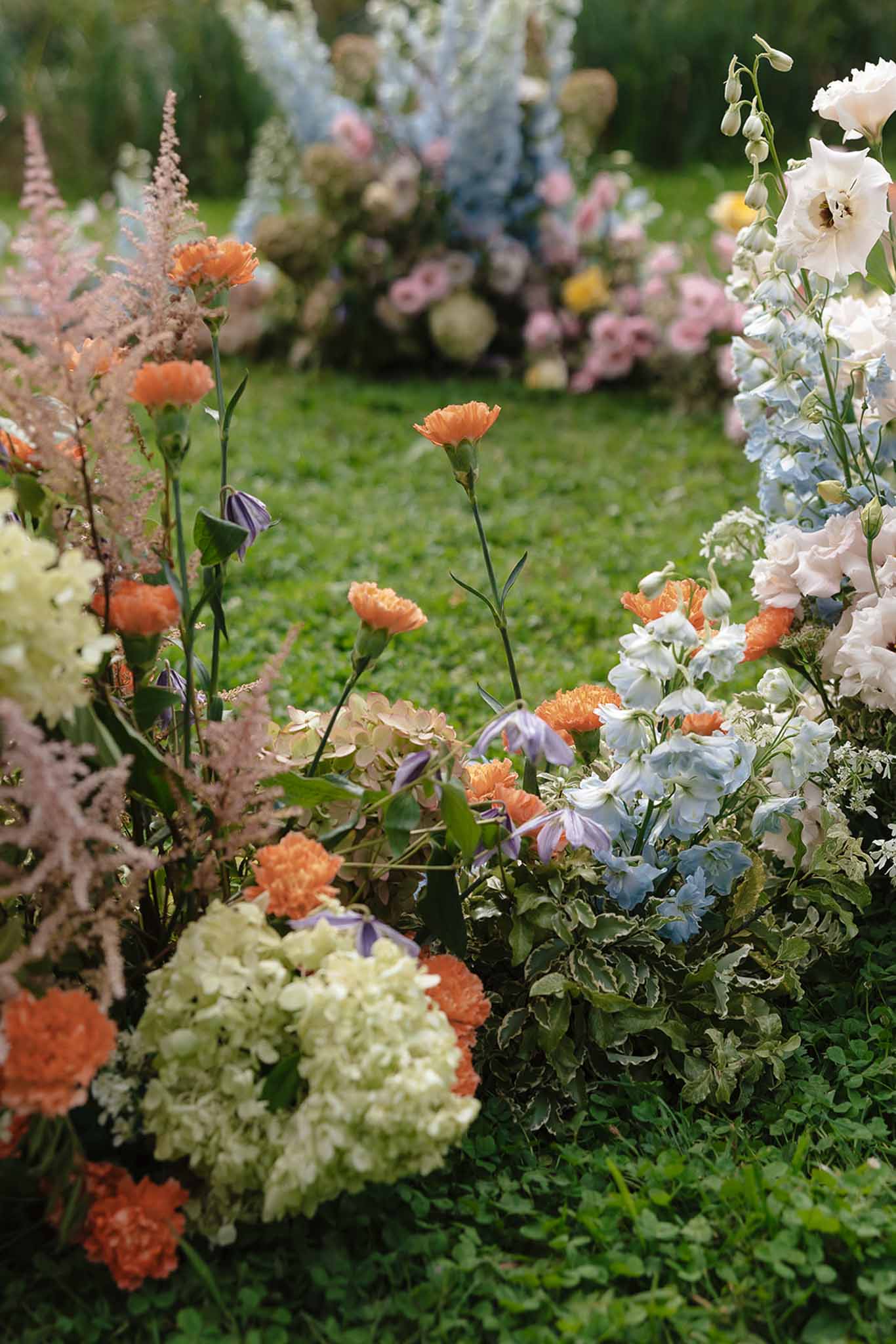 Wedding ceremony setup in a garden with hydrangeas