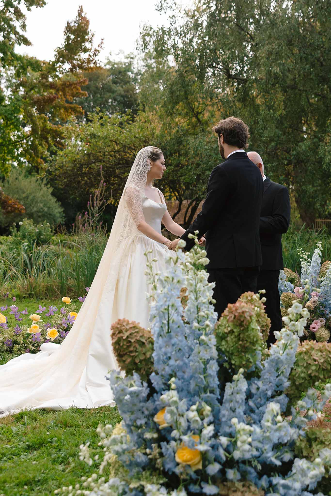 Wedding ceremony in a garden with white roses