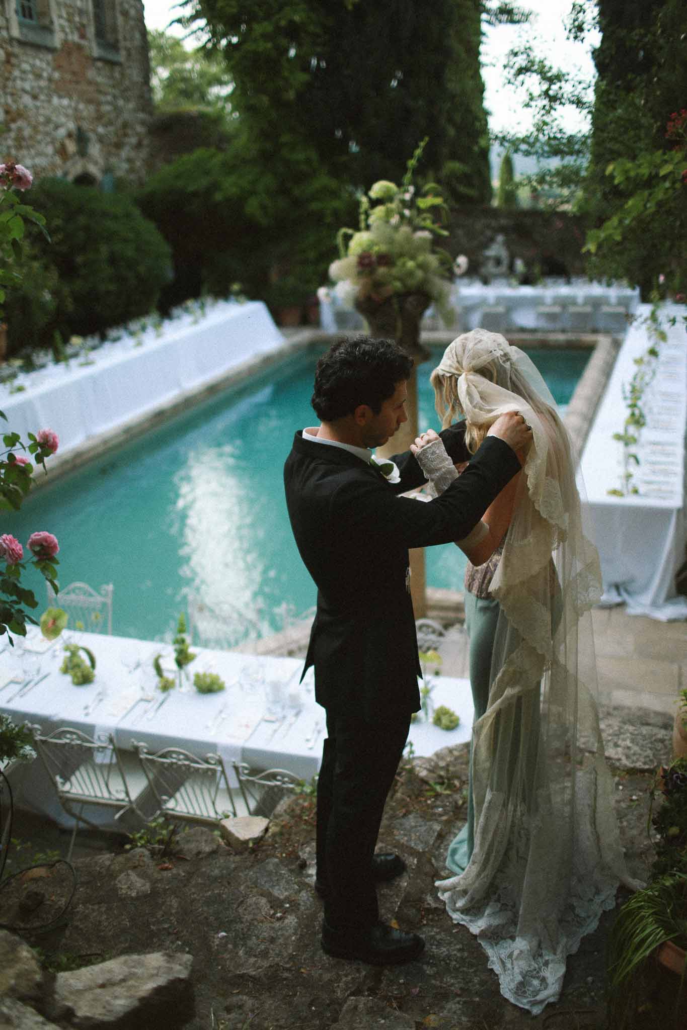 Detail of bride's vintage lace dress at reception at Chateau St Victor Lacoste