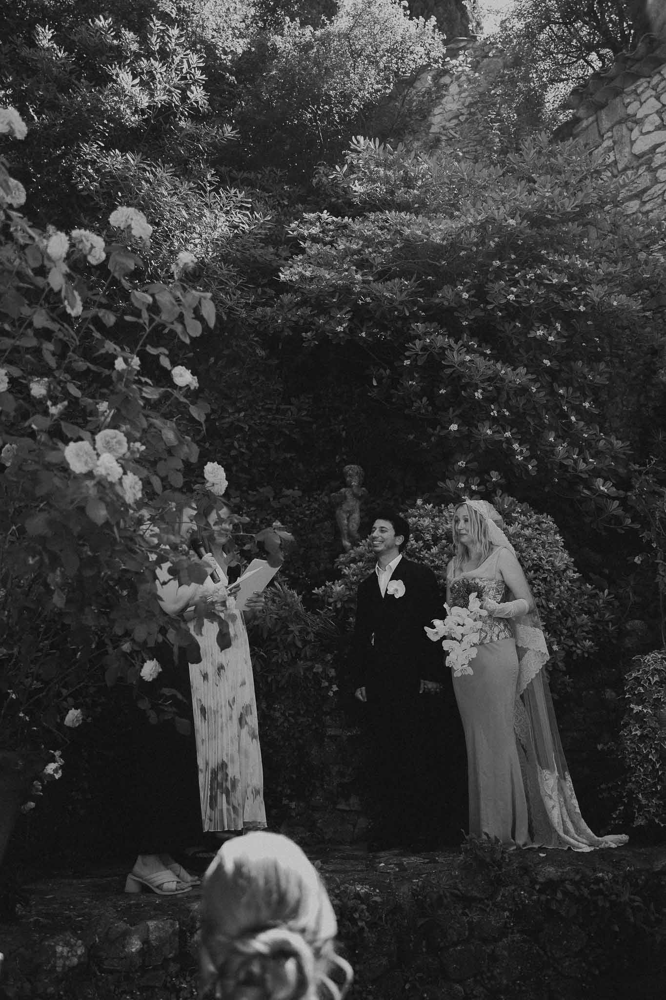 Couple and officiant during the wedding ceremony at Chateau St Victor Lacoste