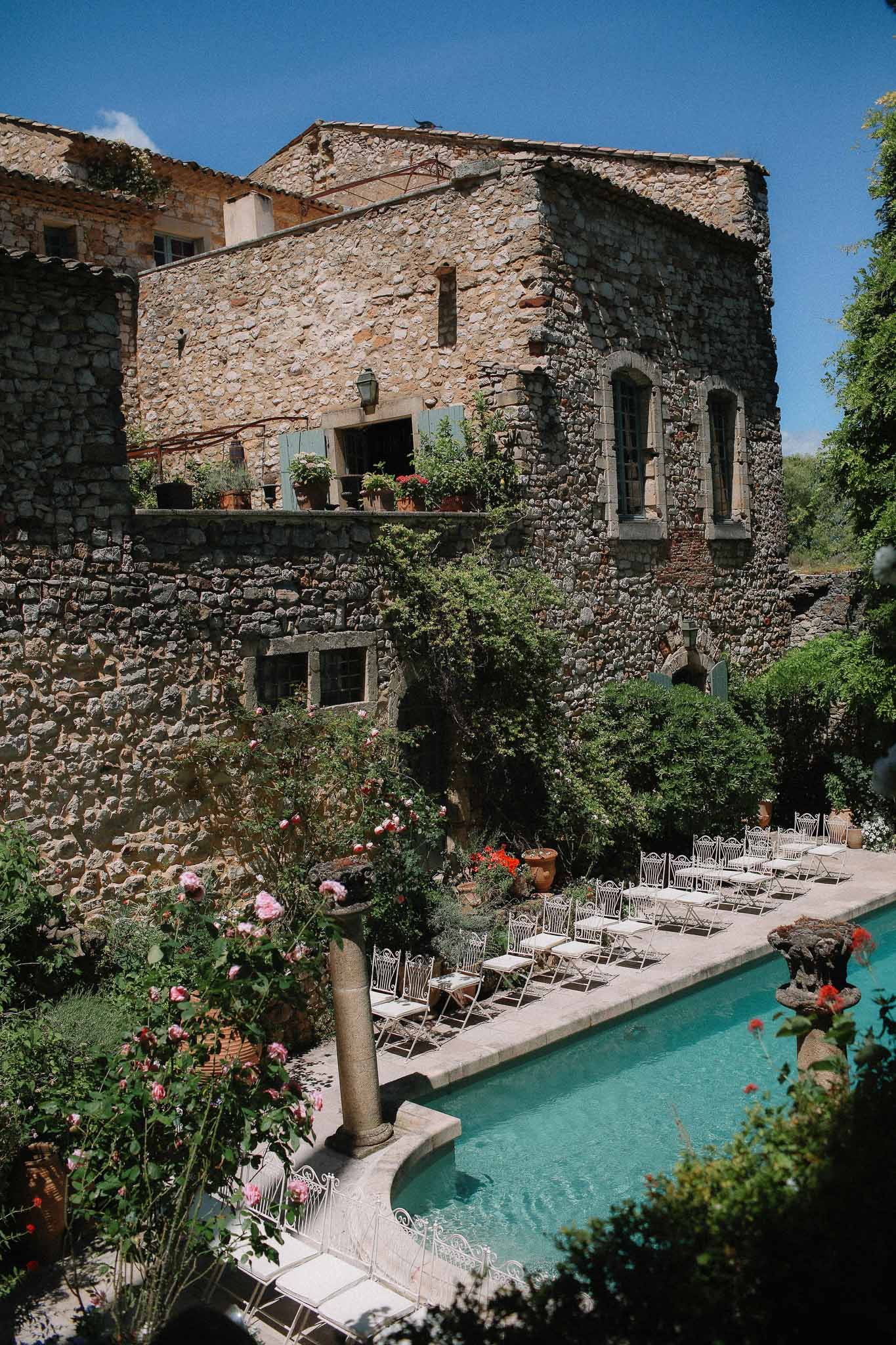 Ceremony area between pool and garden at Chateau St Victor Lacoste