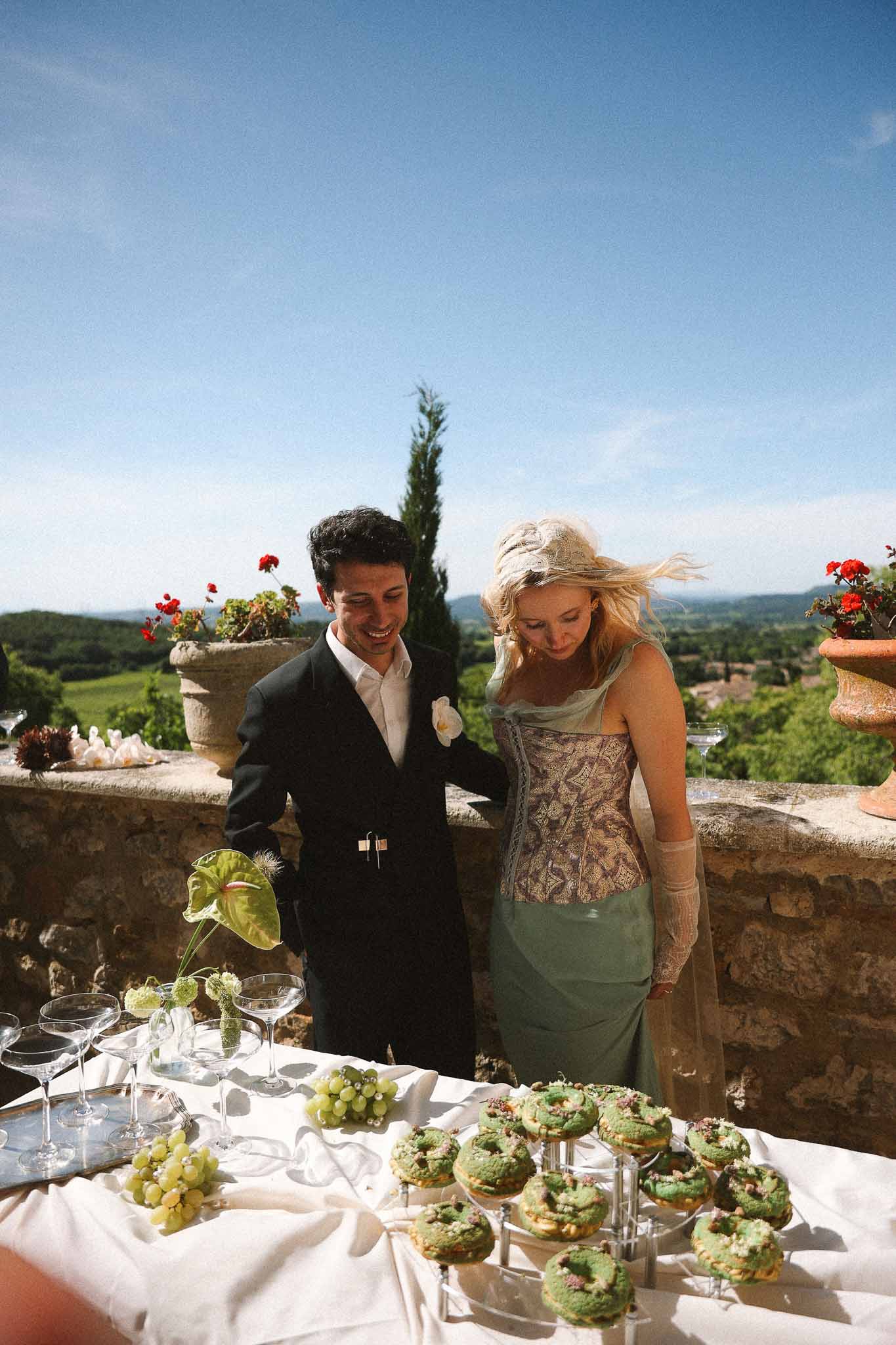 Couple at vegetarian buffet table during reception at Chateau St Victor Lacoste