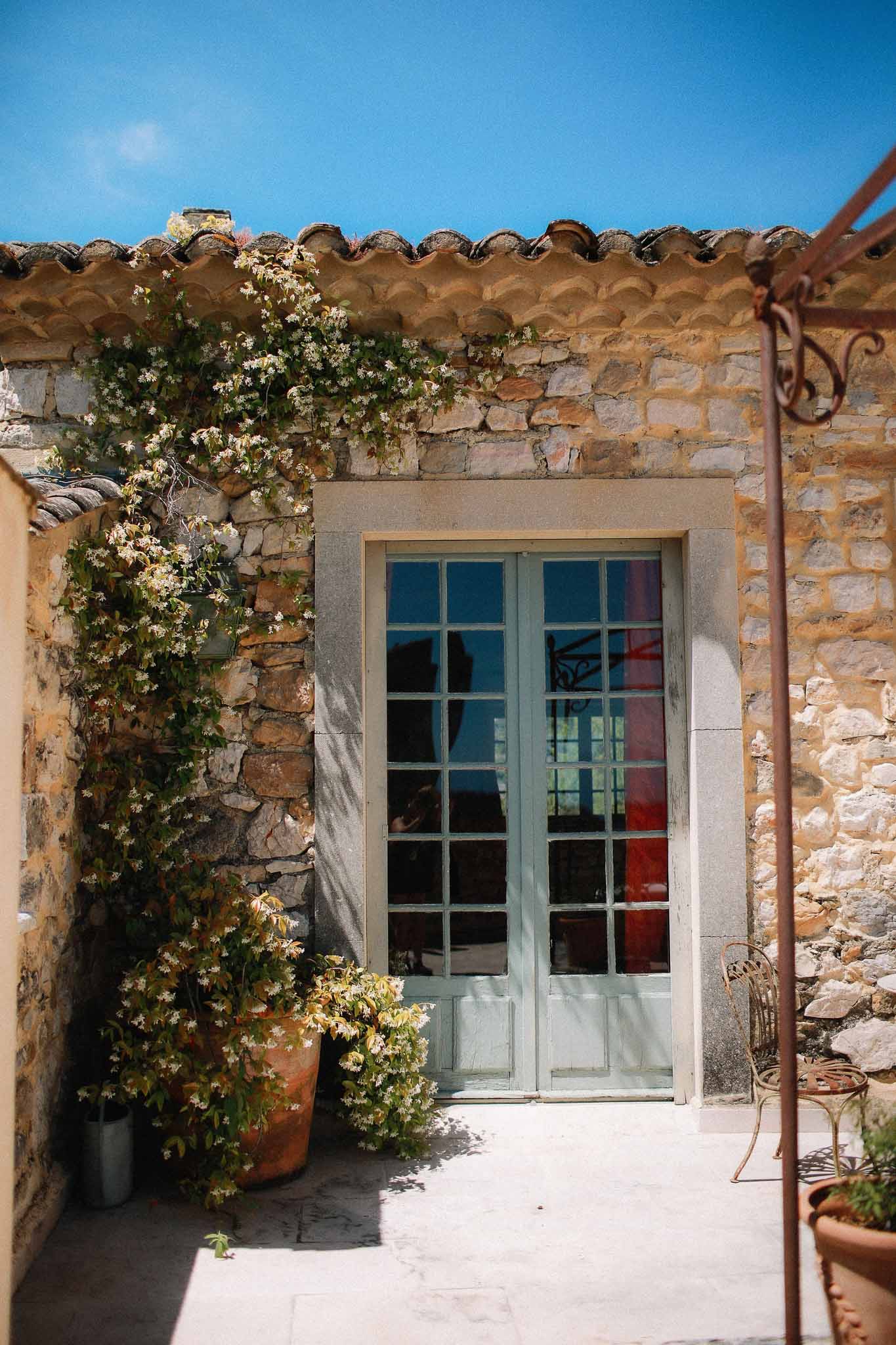 Chateau door opening to garden view at Chateau St Victor Lacoste