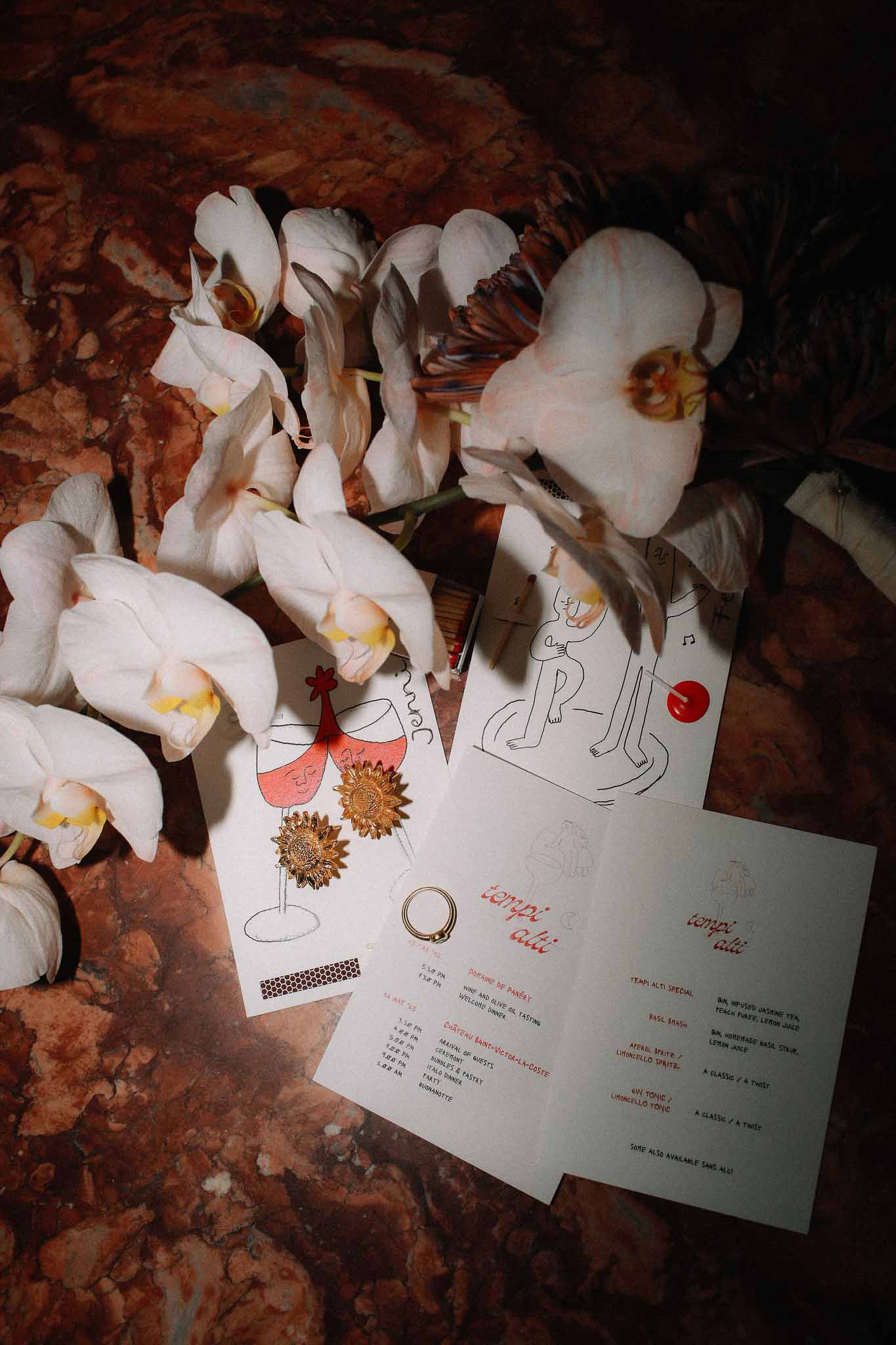 Wedding invitation flat lay with flowers at Chateau St Victor Lacoste