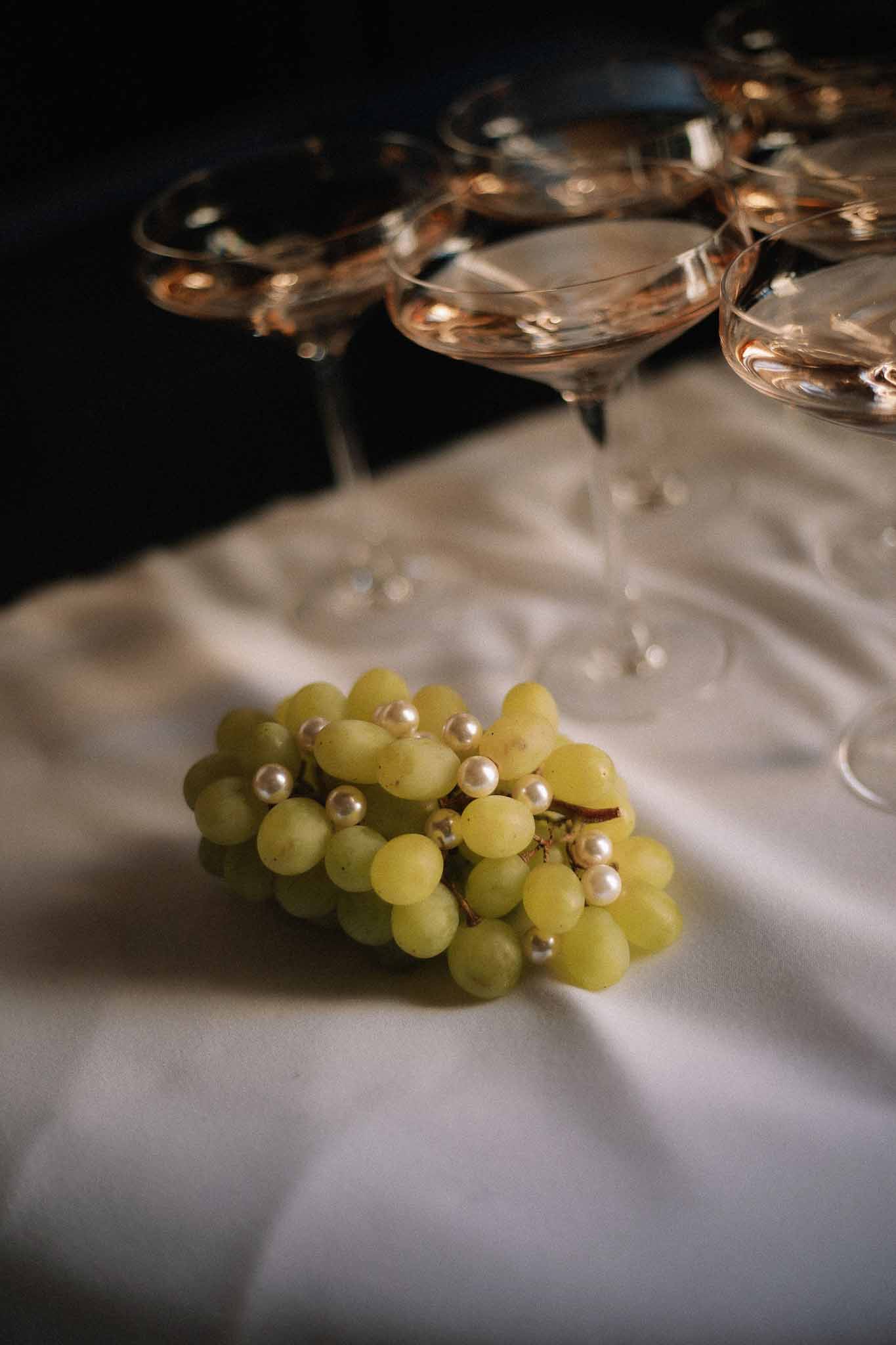 Pearl-stemmed champagne glass and food detail at Chateau St Victor Lacoste