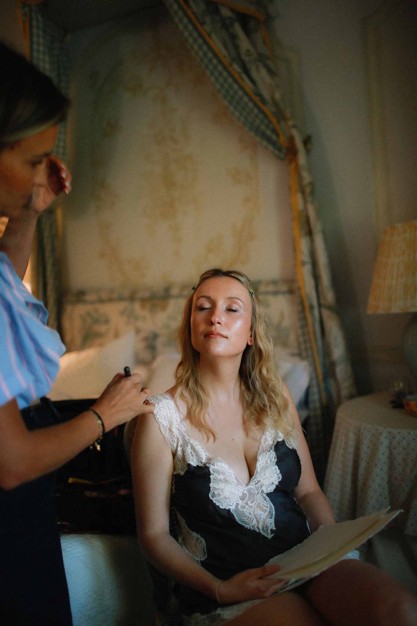 Bride having professional make-up applied at Chateau St Victor Lacoste