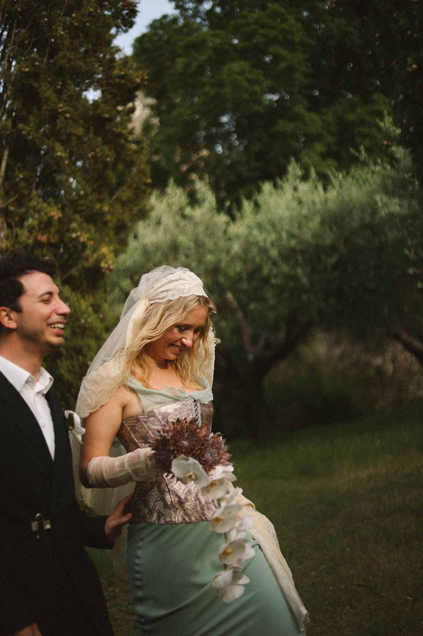 Couple walking at golden hour at Chateau St Victor Lacoste
