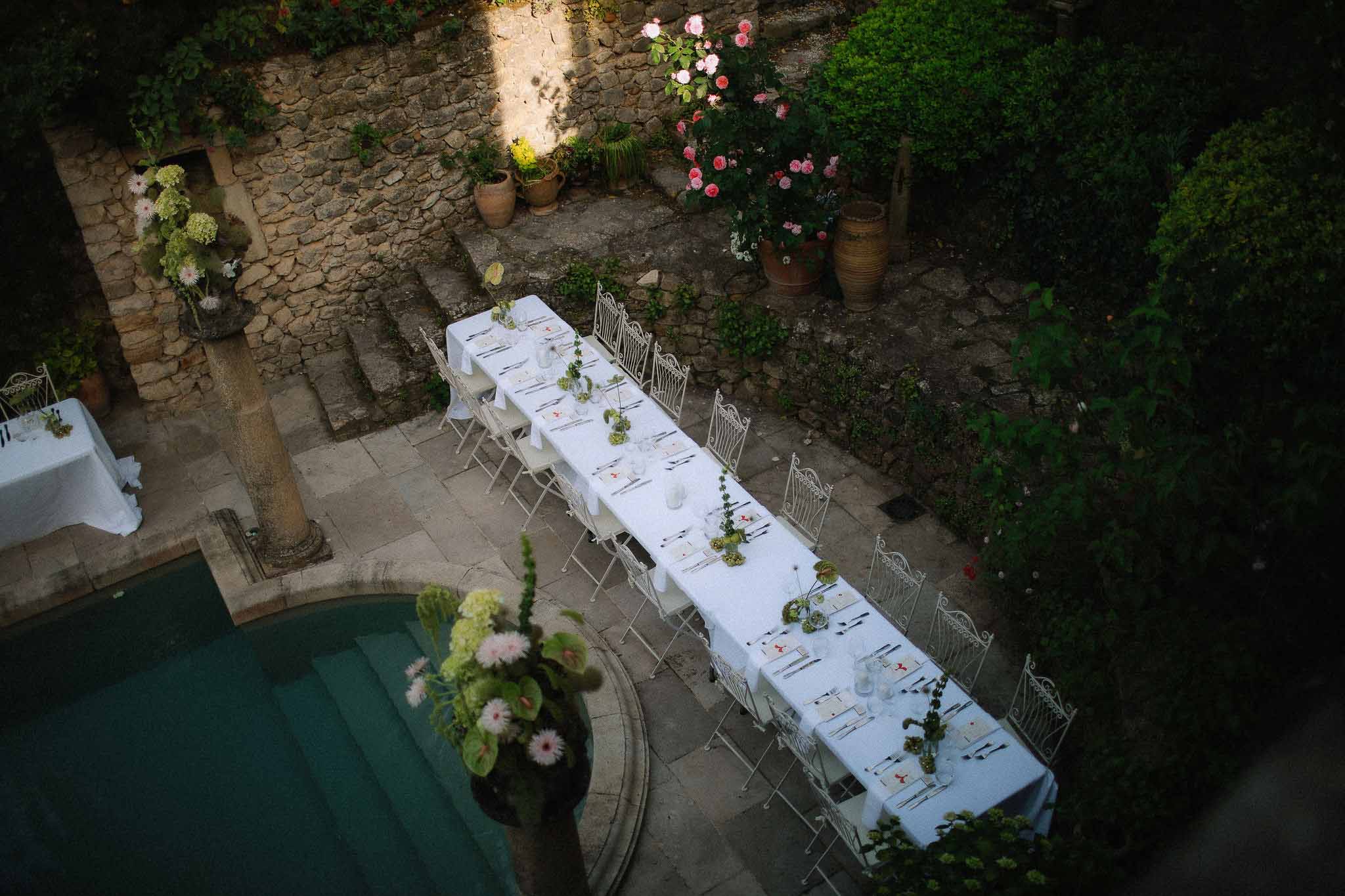 Long white reception tablescape at Chateau St Victor Lacoste