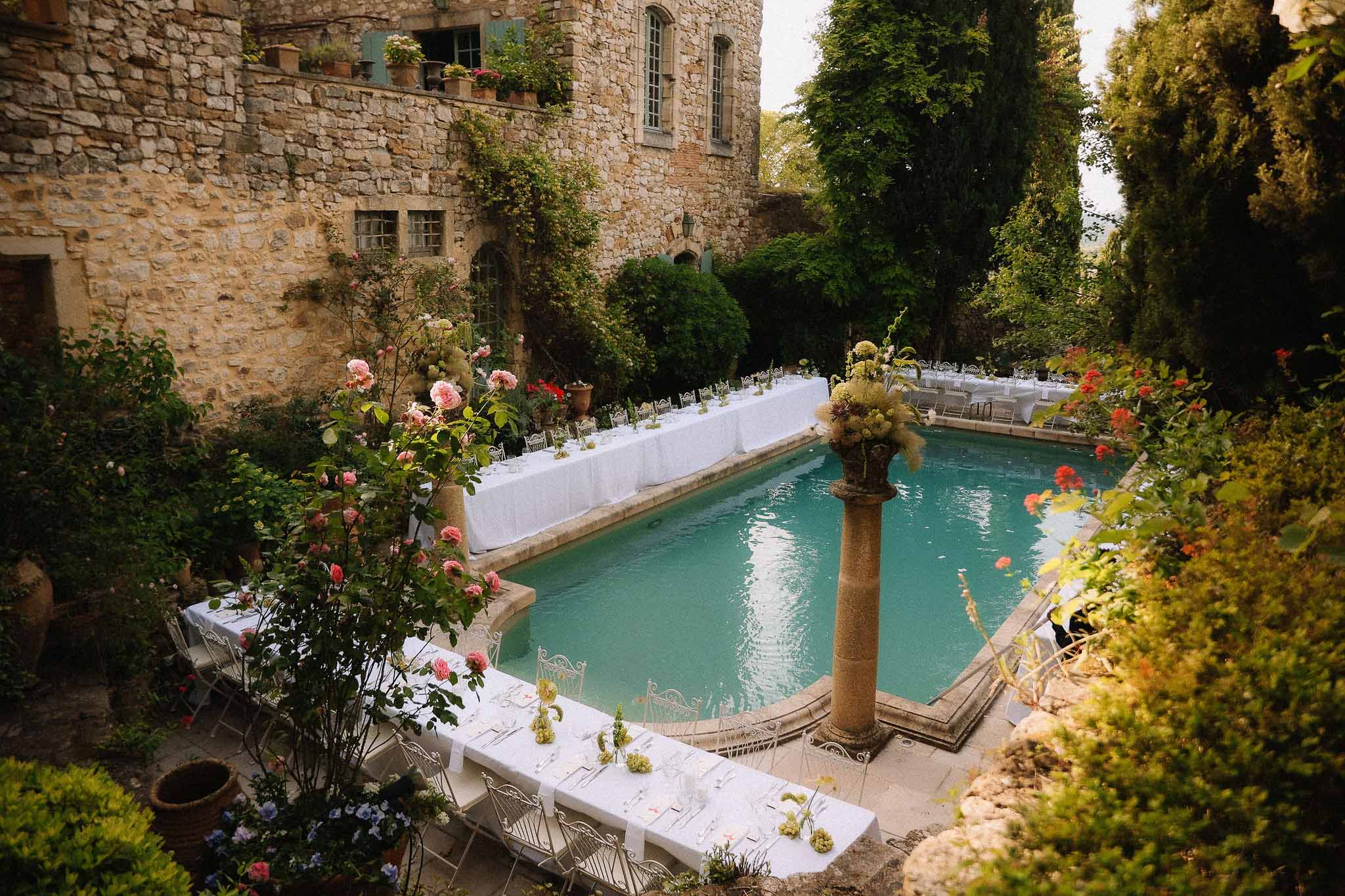 Tablescape at poolside garden reception at Chateau St Victor Lacoste