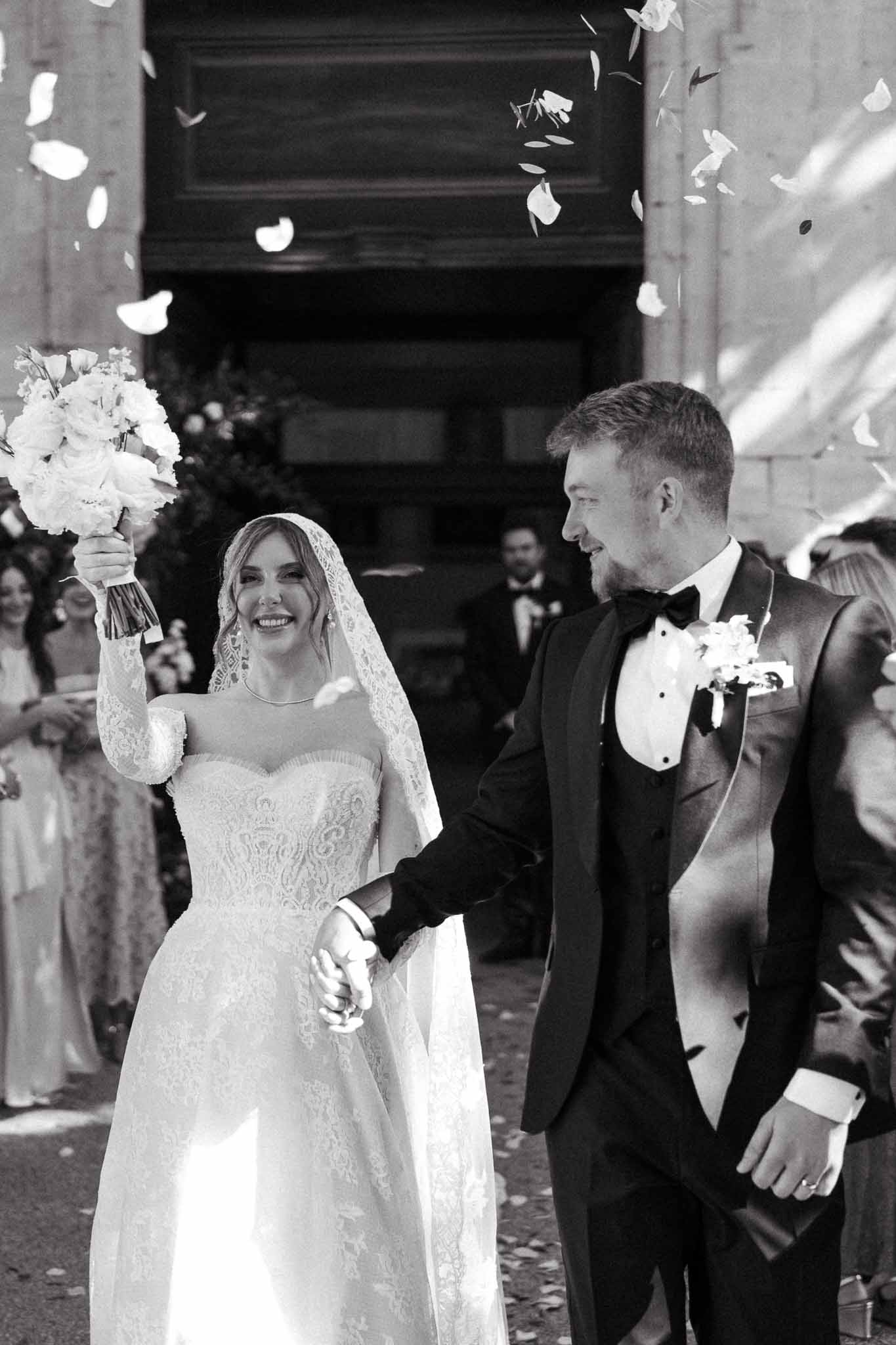 Black and white photo of bride and groom portrait in a chapel