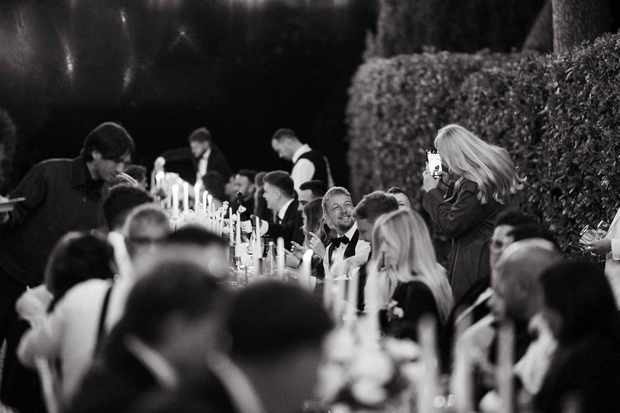 Black and white photo of wedding reception table setting